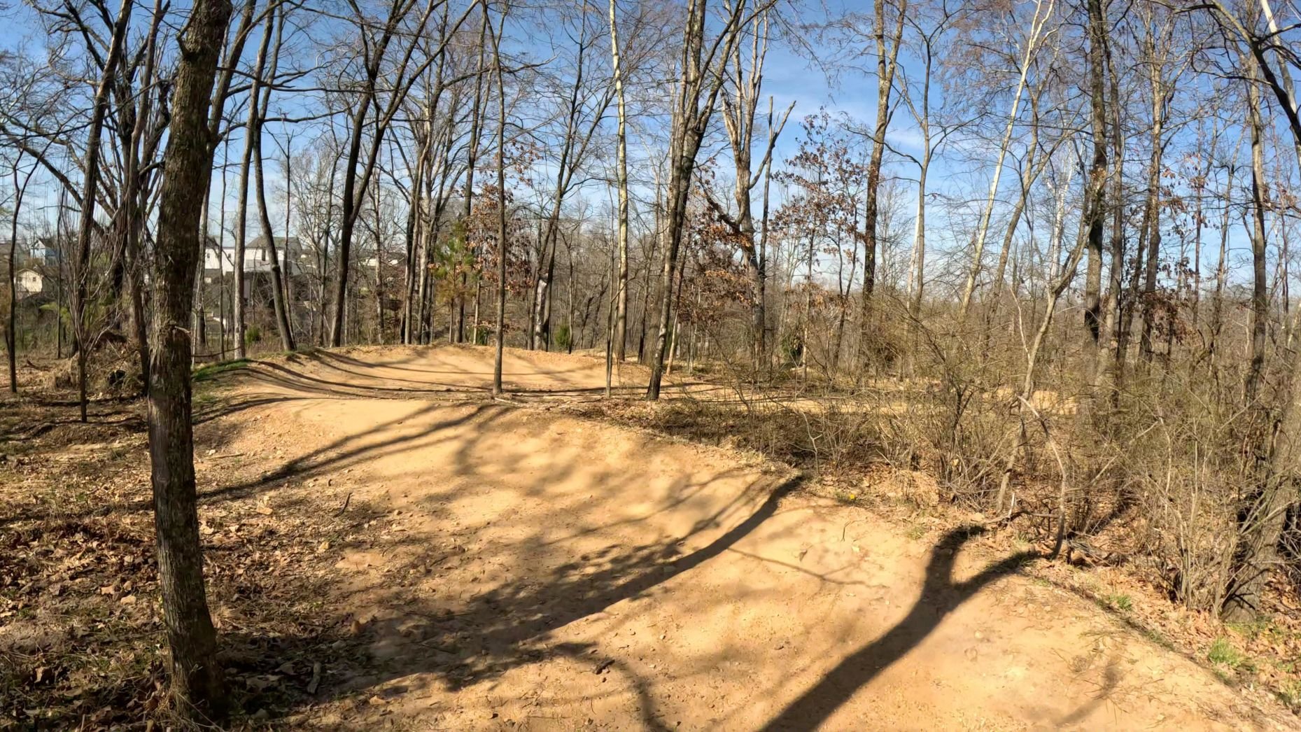 One of the bigger berms on All American before the trail gets to the pedestrian bridge after Crystal Bridges