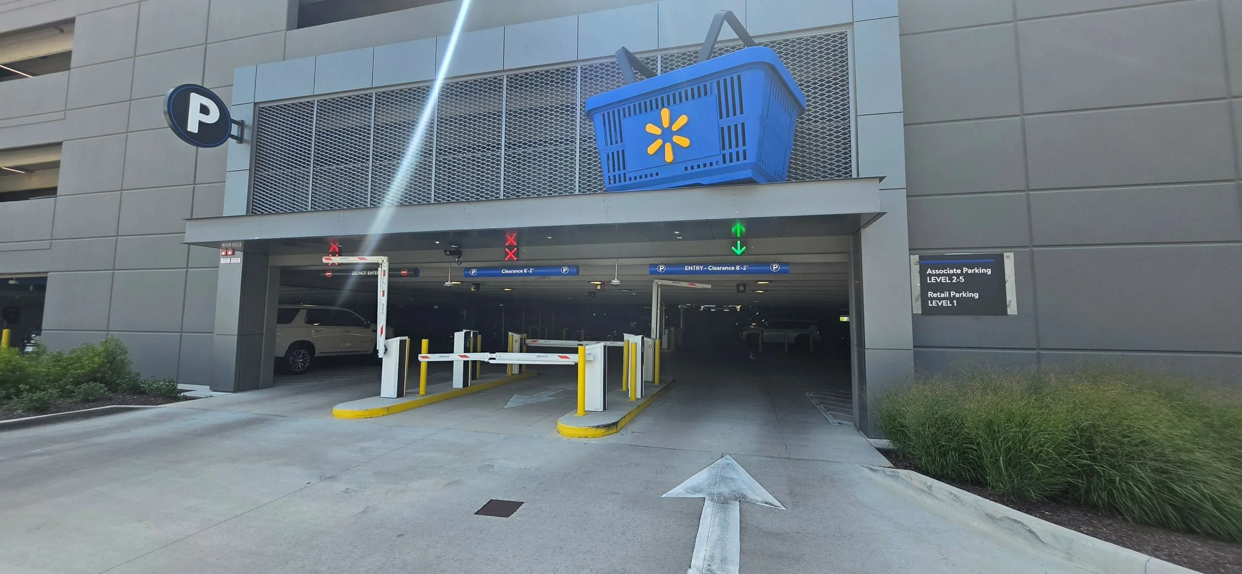 A picture of one of the parking garages off of 8th Street. The 1st floor is dedicated to the public all other floors are for Walmart Associates