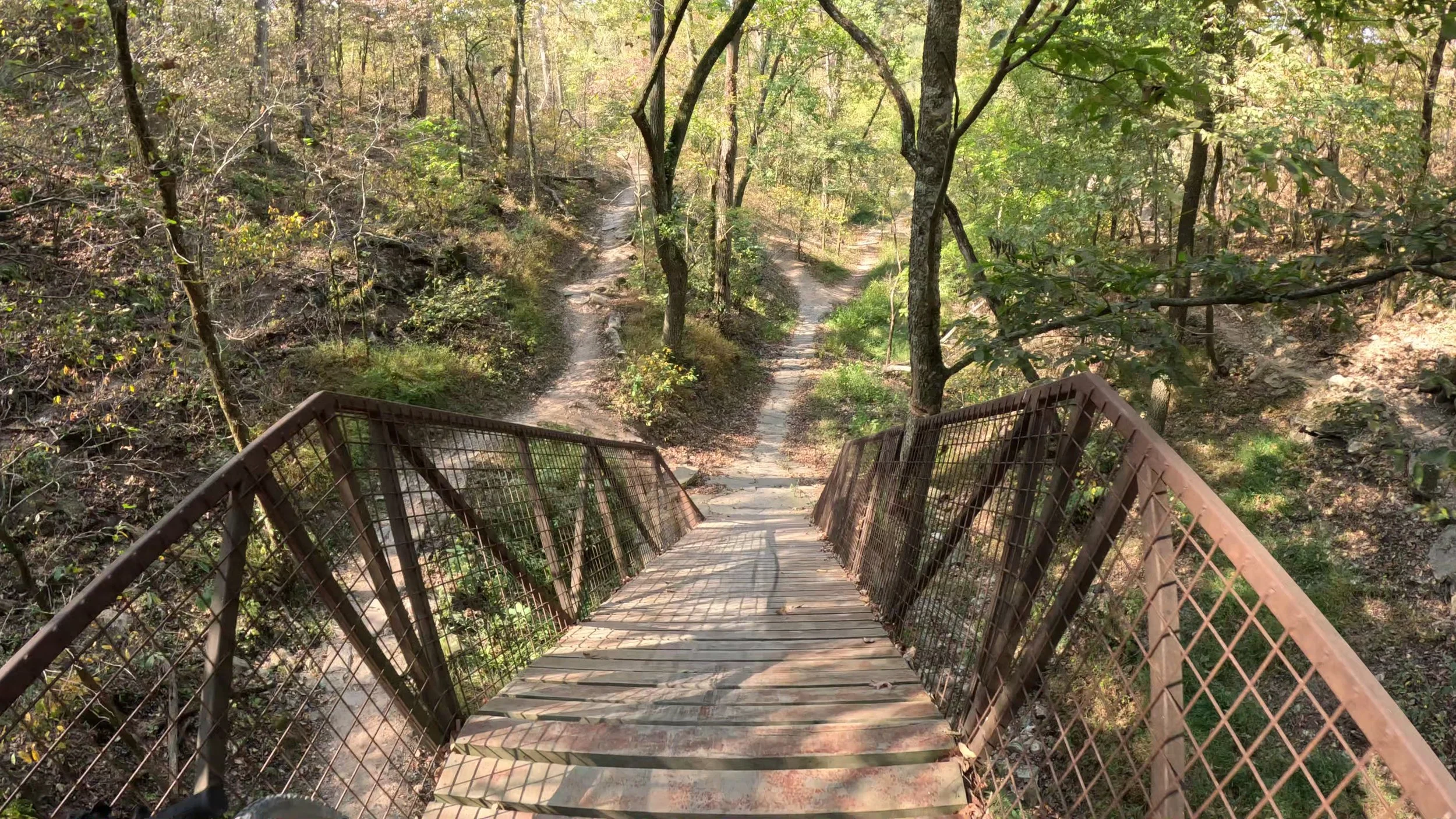 This is the very steep ramp at the end of Hard Way to Cafe that ends at Airship Coffee in the center of Coler MTB Preserve in Bentonville Arkansas