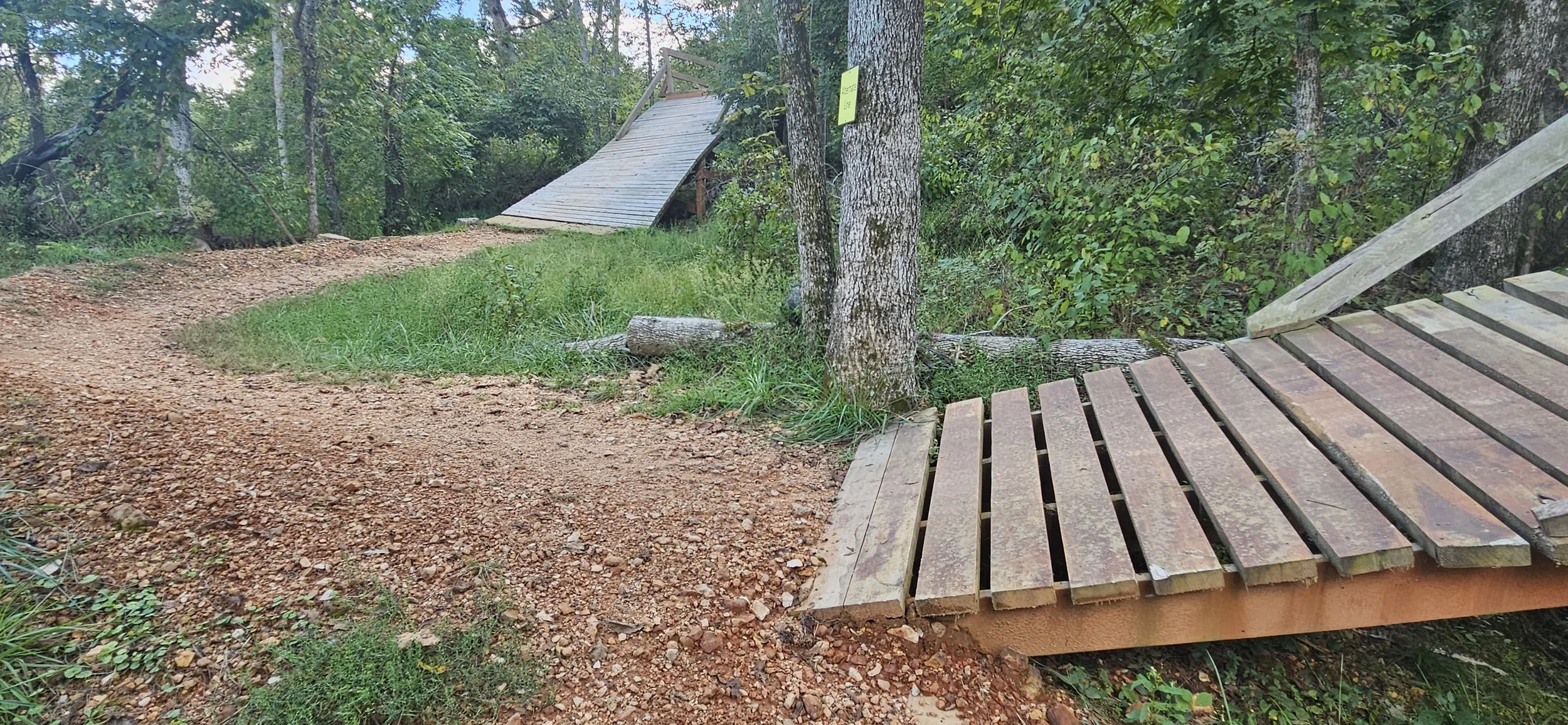 Two wooden features along the Tech Gnar trail a black diamond trail in the Slaughter Pen Trail system