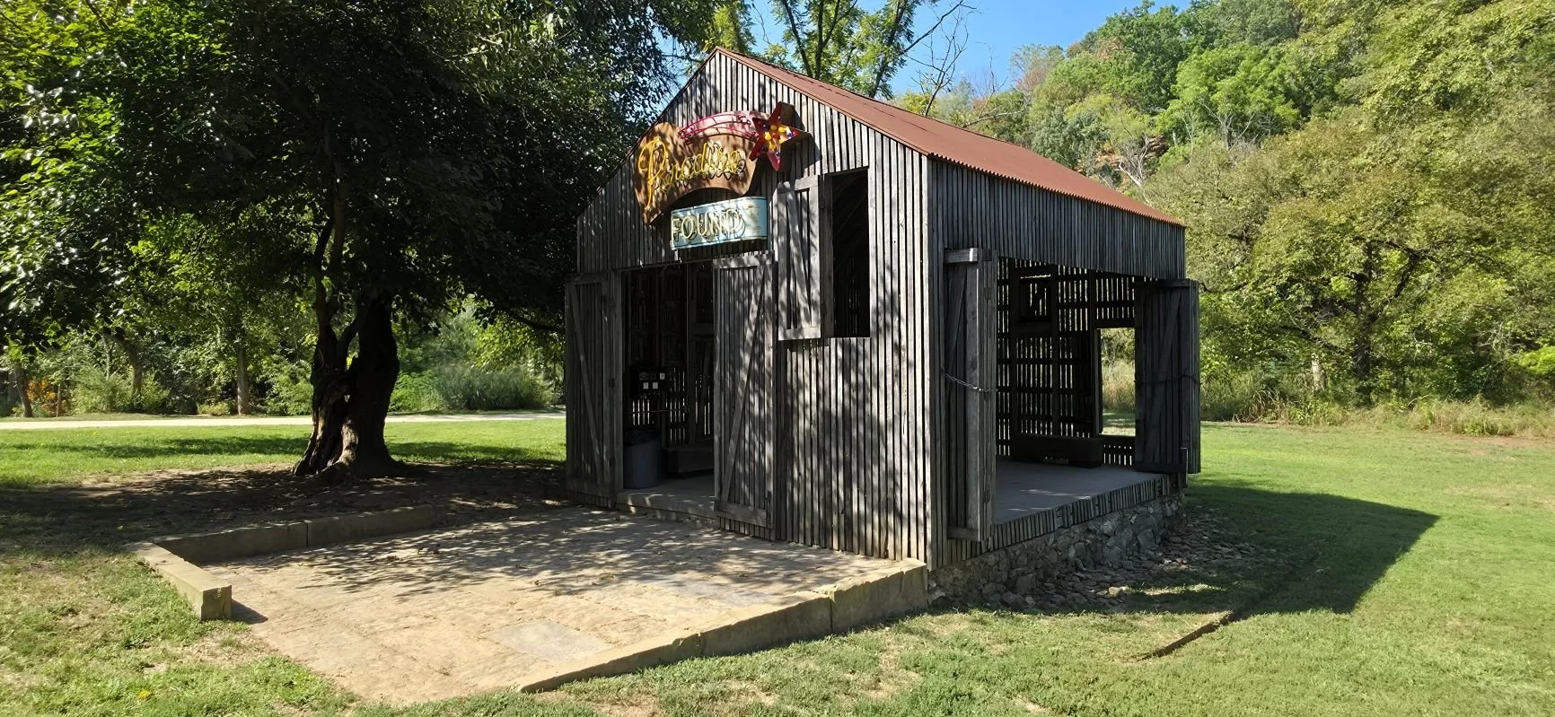 a picture of the iconic Paradise Found barn near Airship Coffee in Coler MTB Preserve in Bentonville Arkansas
