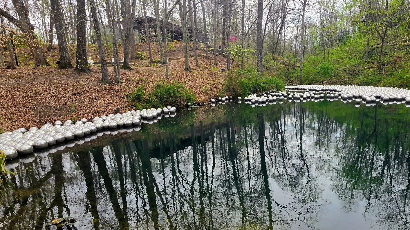 The pond that is found alongside the Art Trail and its free floating Chrome balls that adjust their position due to wind or other factors