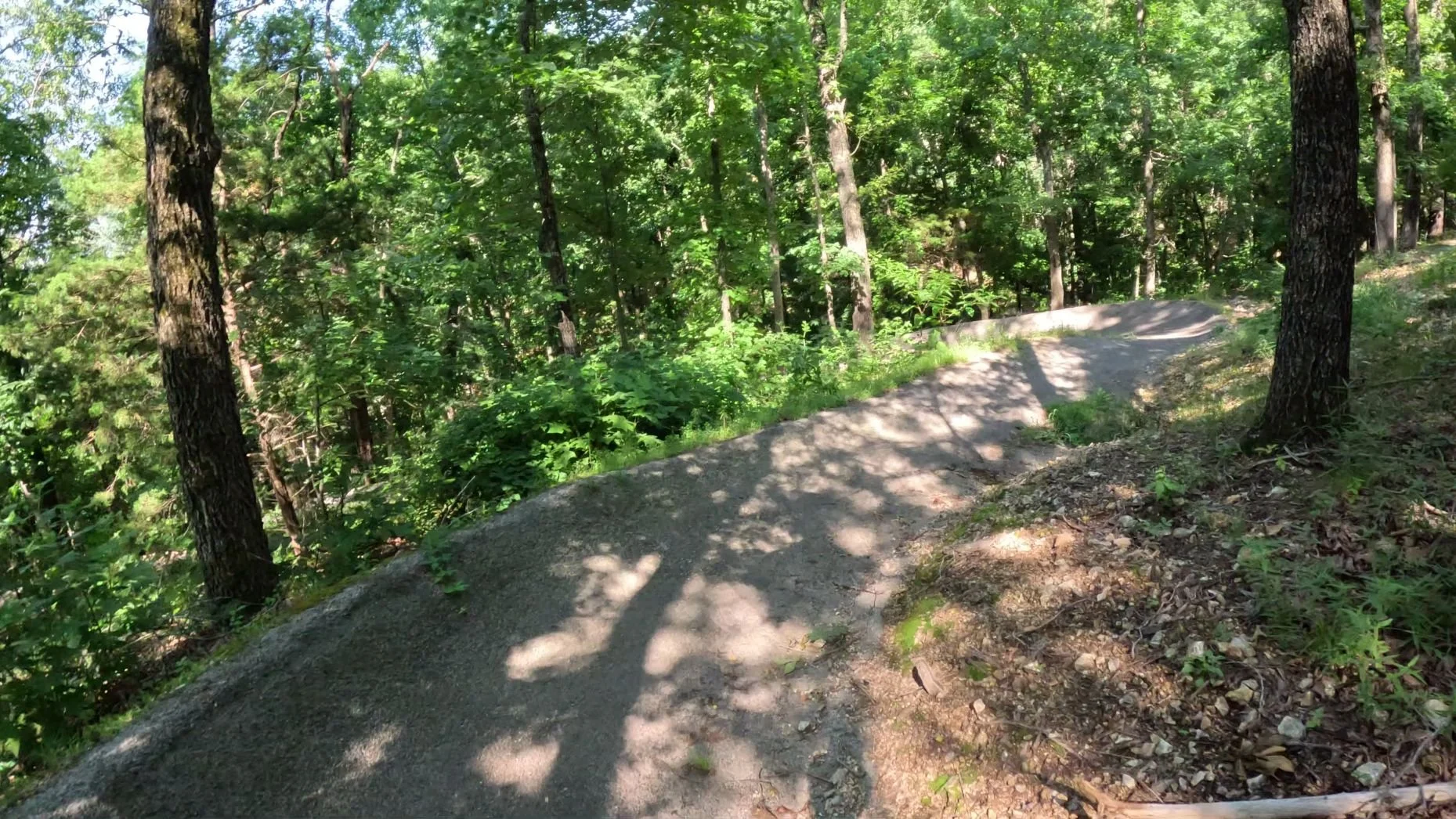 A picture of one of the many paved berms found on Ace of Spades in Bella Vista's Wonderland Trail System