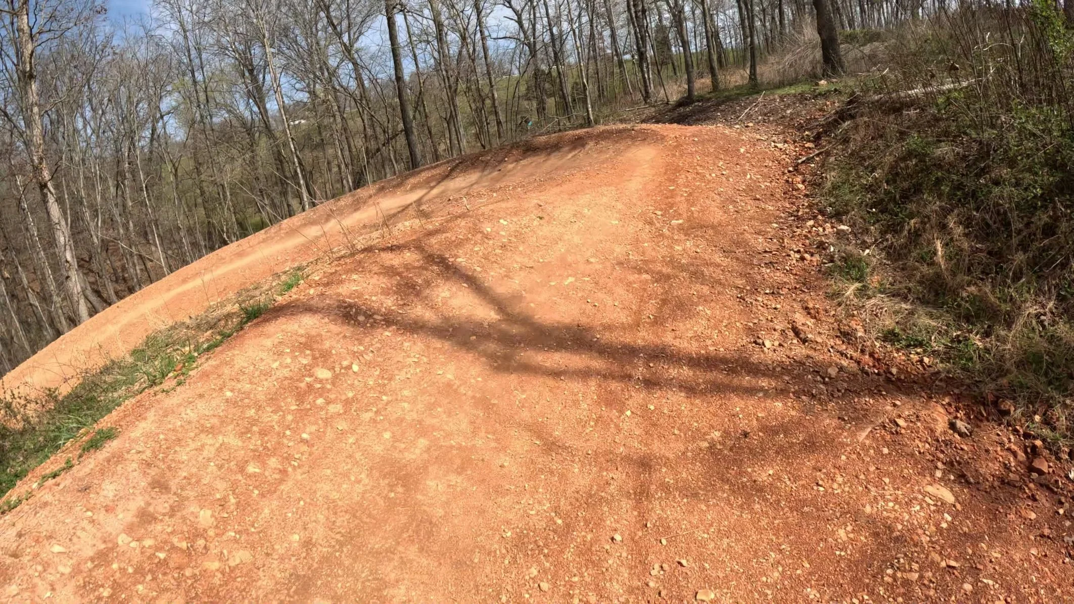 An Image of one of the first large berms on Catapult a trail that originates from the Castle in Slaughter Pen in Bentonville Arkansas