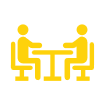 Two yellow stick-figure people sitting at a table facing each other