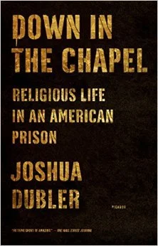 Book cover titled 'Down in the Chapel: Religious Life in an American Prison' by Joshua Dubler, with a black background and gold text.