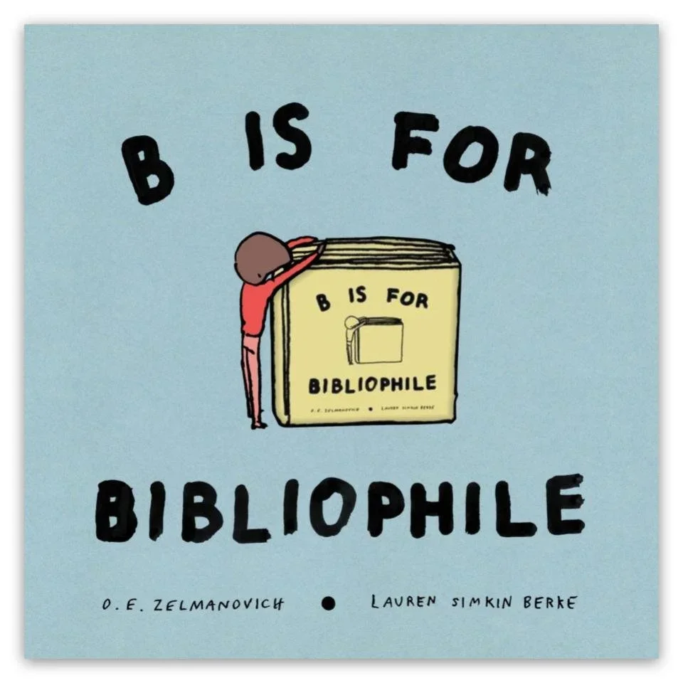 A book cover titled "B is for Bibliophile" with an illustration of a person leaning on a giant book. The cover has a light blue background and black text.
