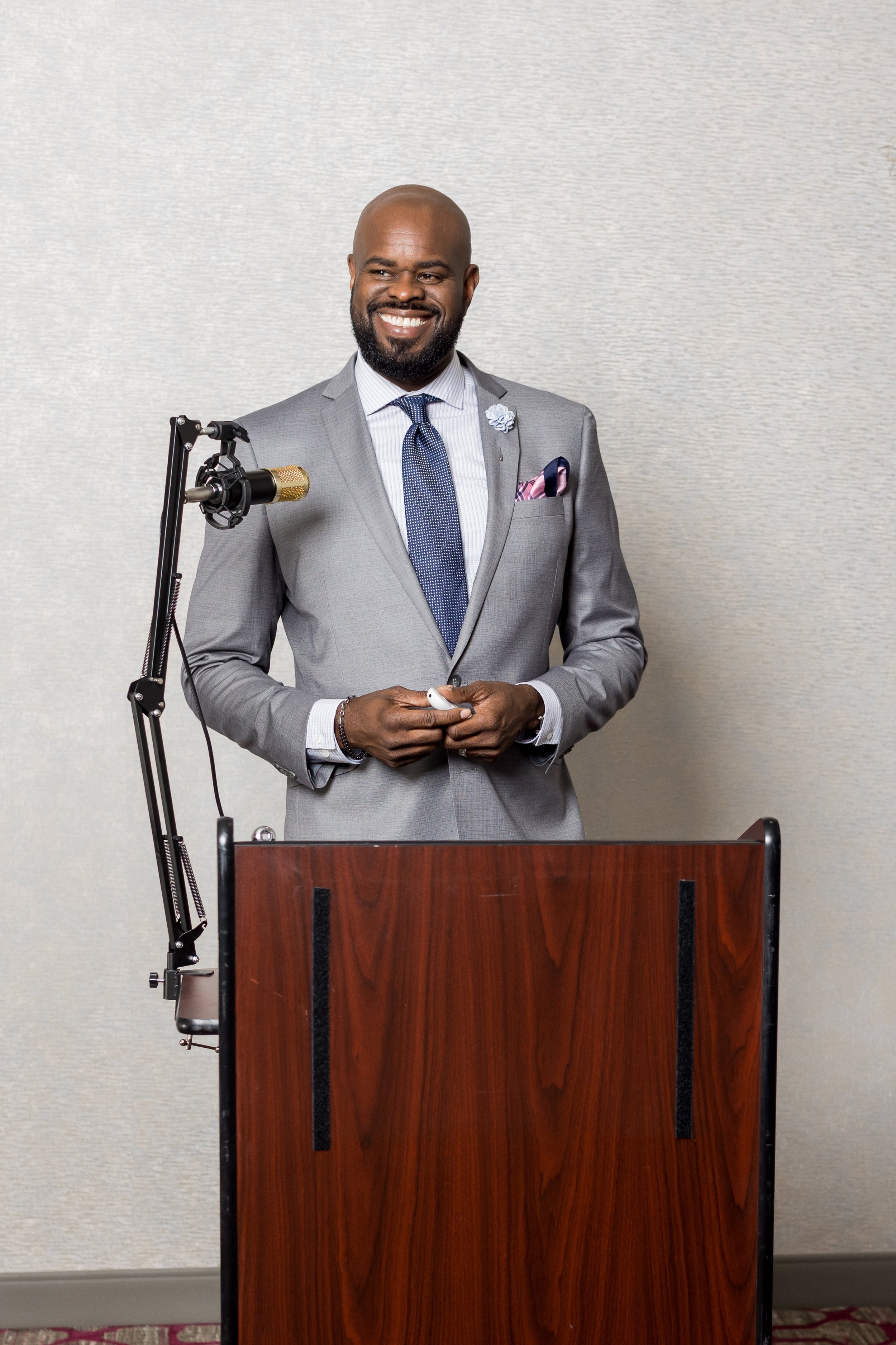 Corporate event photography capturing a keynote speaker during a professional presentation, highlighting leadership, engagement, and modern business environments.