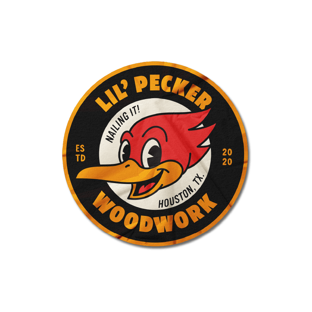 A circular logo of Lil' Pecker Woodwork featuring a cartoon red and yellow bird with a smile, the text 'NAILING IT!' above the bird, 'LIL' PECKER' at the top, 'WOODWORK' at the bottom, 'Houston, TX.' to the right, and 'ESTD 2020' to the left.
