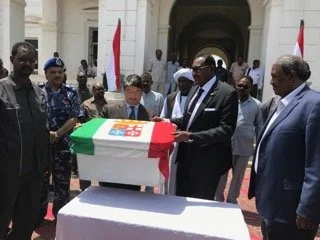 Italian Ambassador in Sudan Fabrizio Lobasso receives the remains of Italian sailor Carlo Acefalo (d. 1940) from the Red Sea State Governor at a ceremony in Port Sudan, April 19, 2018.