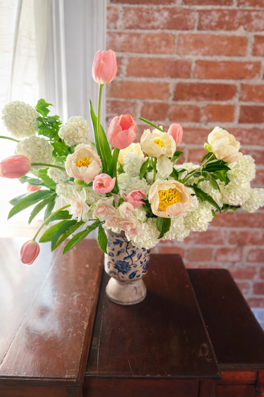 Vibrant bouquet in porcelain vase.png
