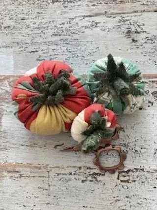 Three decorative fabric tomatoes
