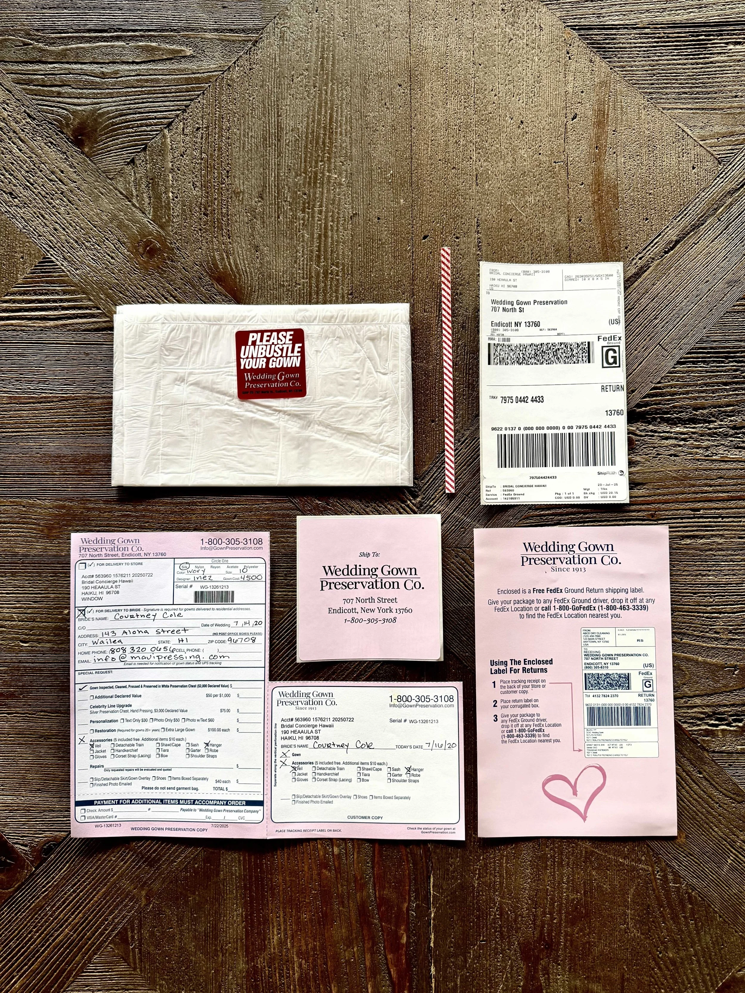 Step 2 - Unpack your kit.  You will find a plastic dress bag, twist tie, prepaid shipping label with instruction sheet, pink return address sticker, info sheet that goes with your dress and info sheet that you keep.  