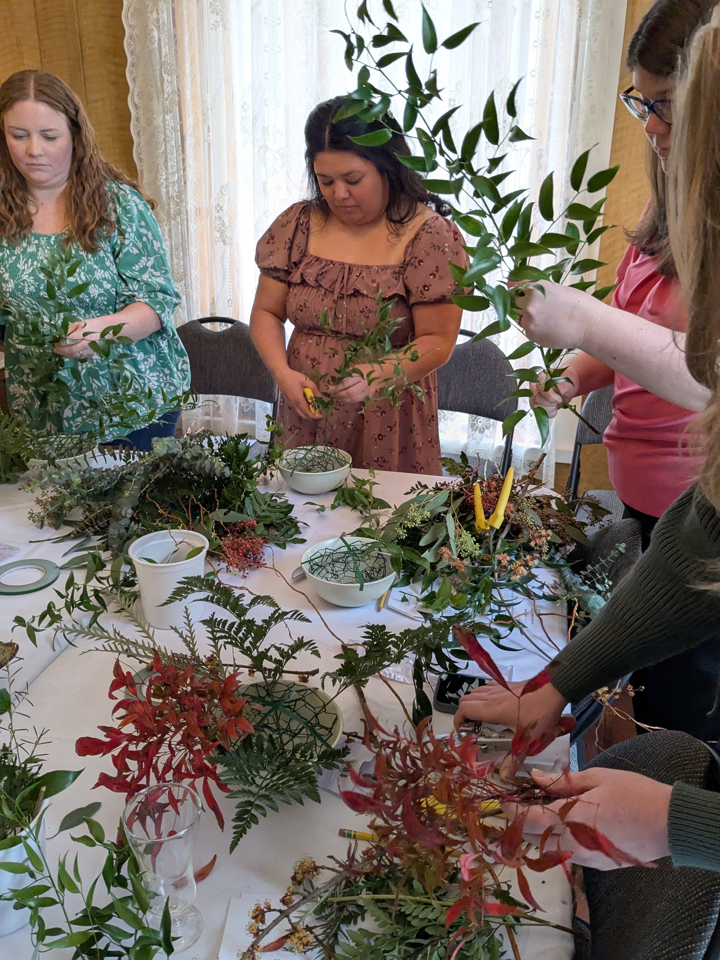 Group of women having fun doing floral design