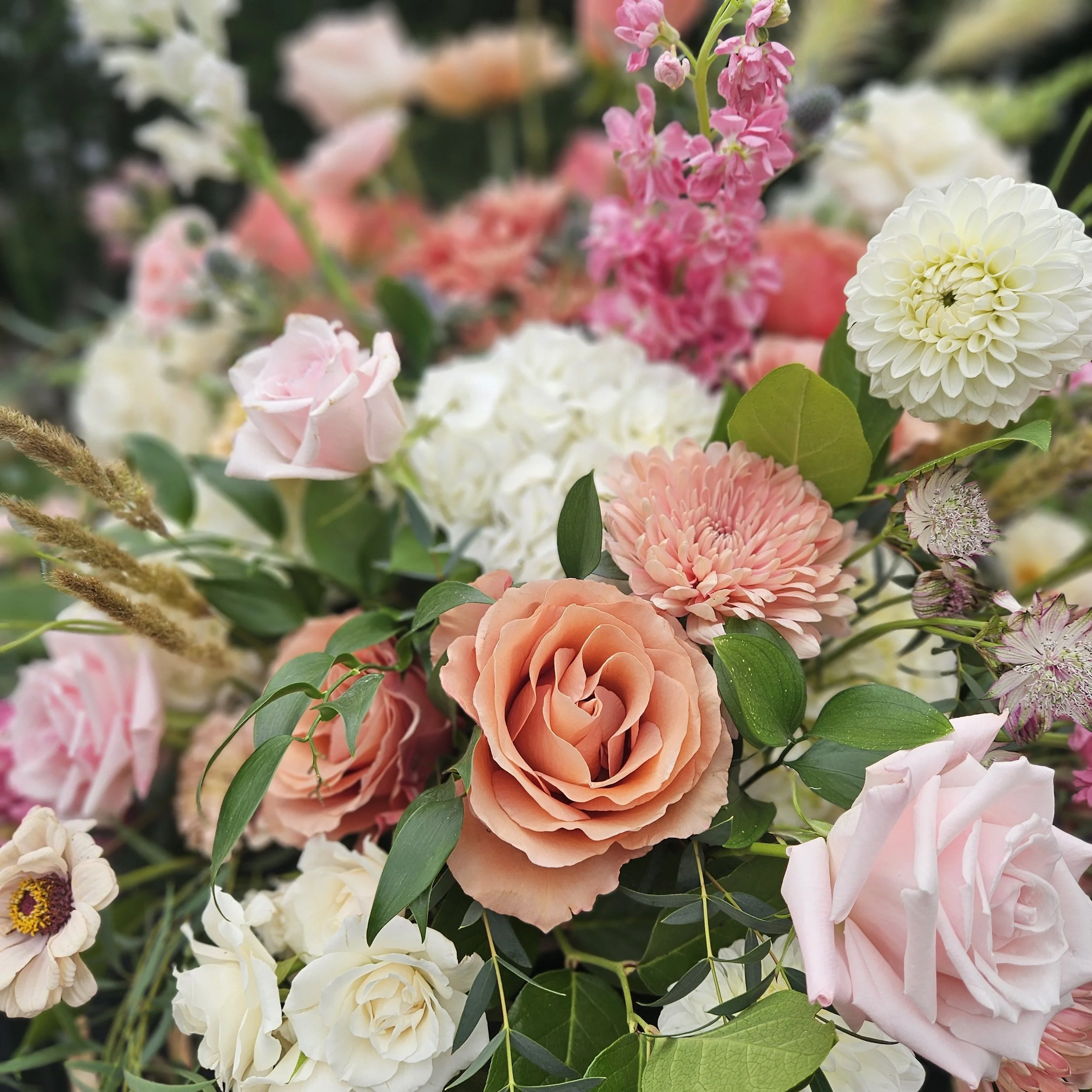 Peach, cream and mauve wedding flowers from floral design workshop