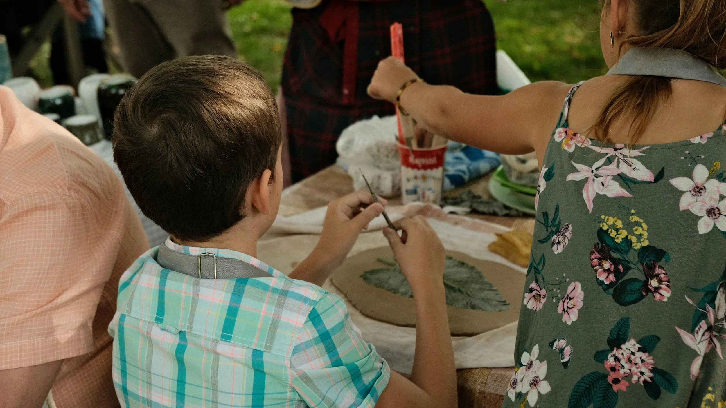 Boy and Girl at an art workshop with flowers