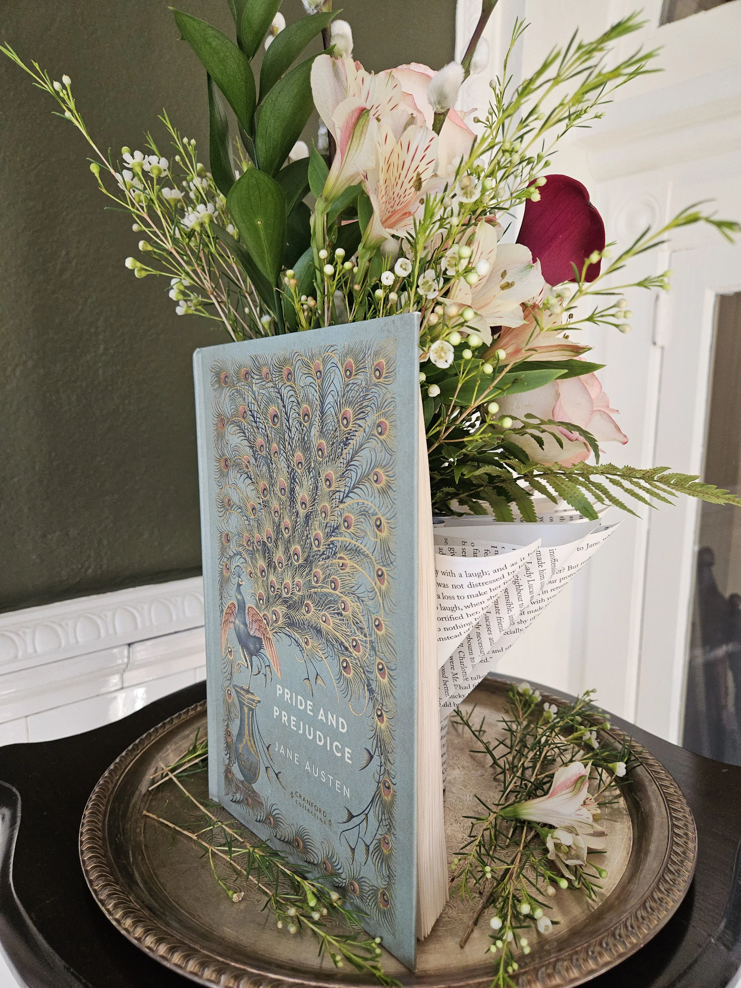 Fresh flowers in sculptural vase made from Pride and Prejudice book