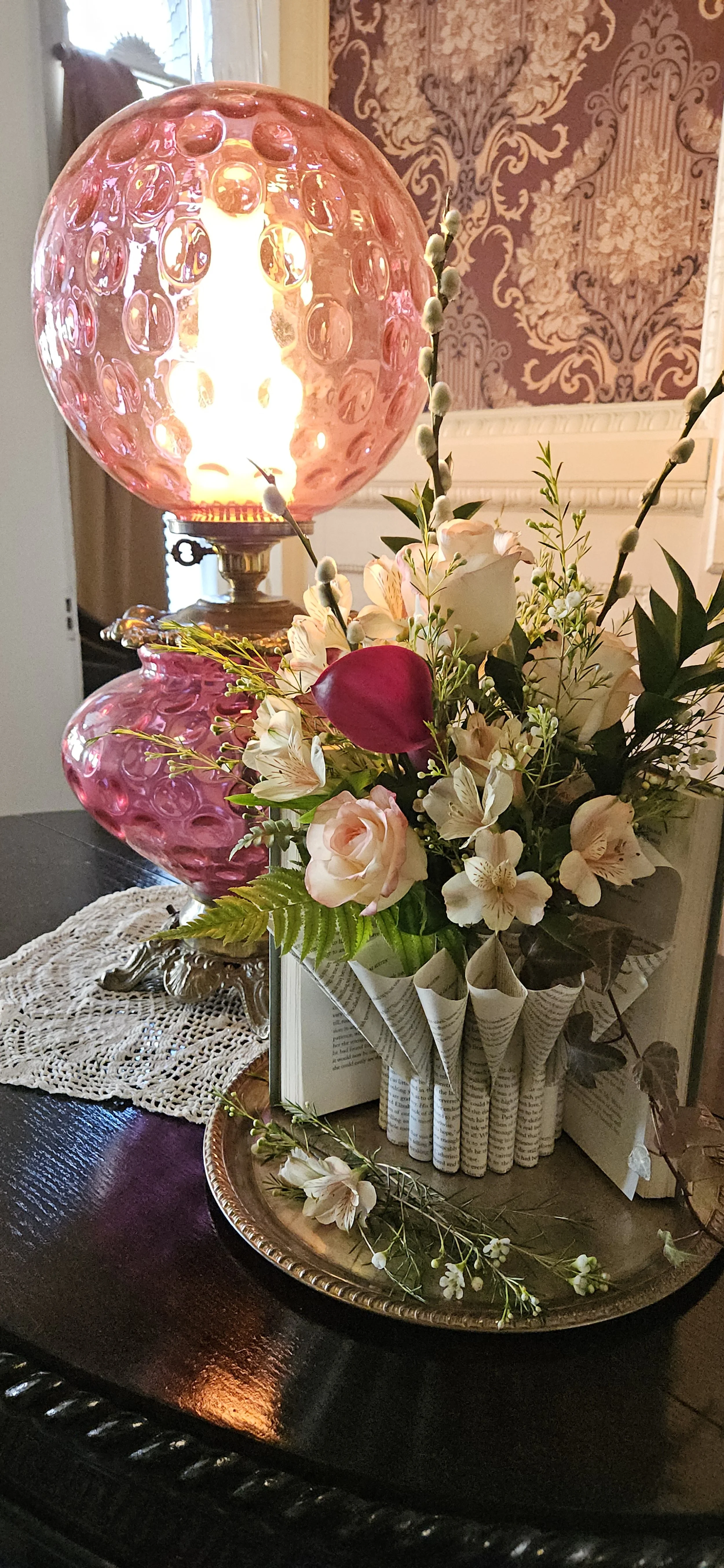 Close up of Blooming Book flowers and vase at Korner's Folly Museum
