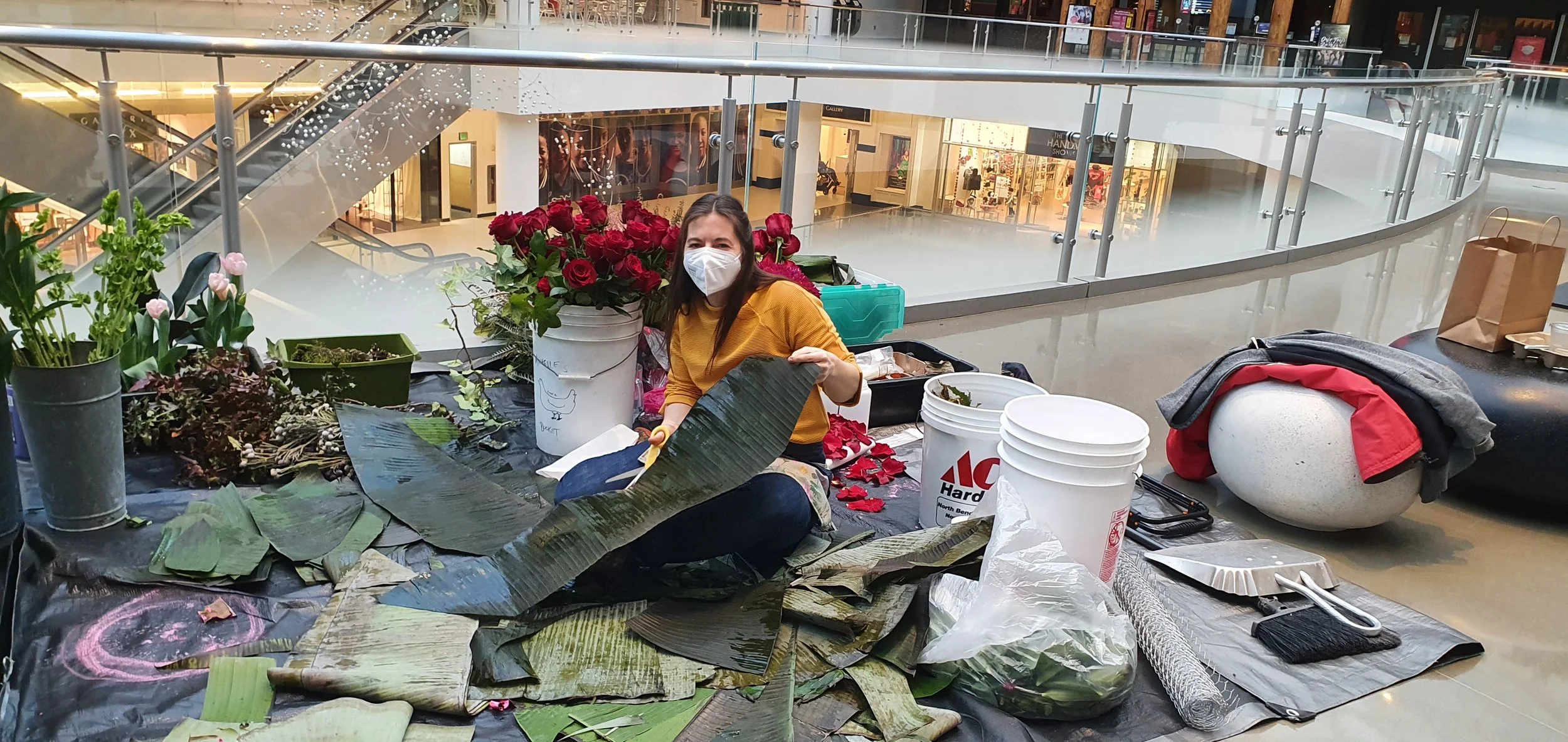 Florist cutting banana leaves for a floral exhibition in Seattle