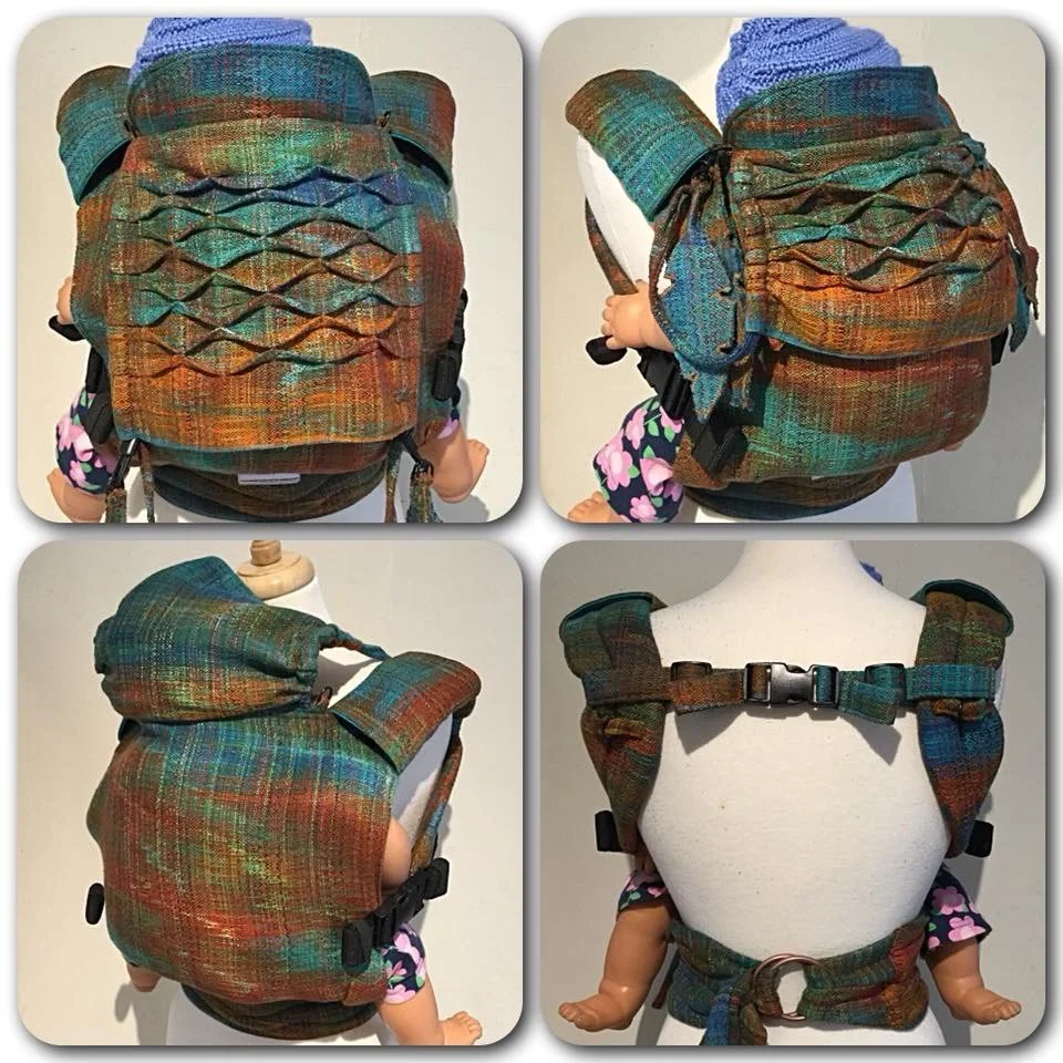 Colorful fabric backpack with a multicolored plaid pattern and laced details, shown from four angles on a baby mannequin.