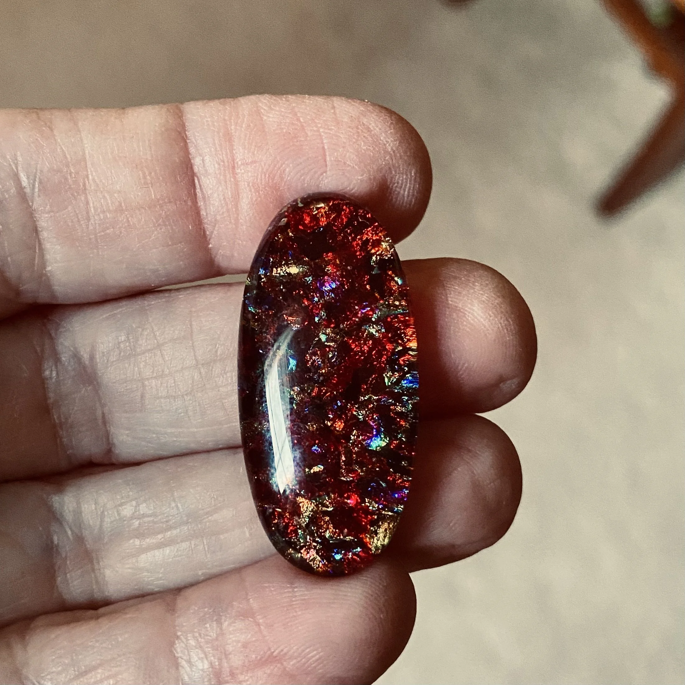 Ruby Red Dichroic Oval Cabochon with Color Shifts