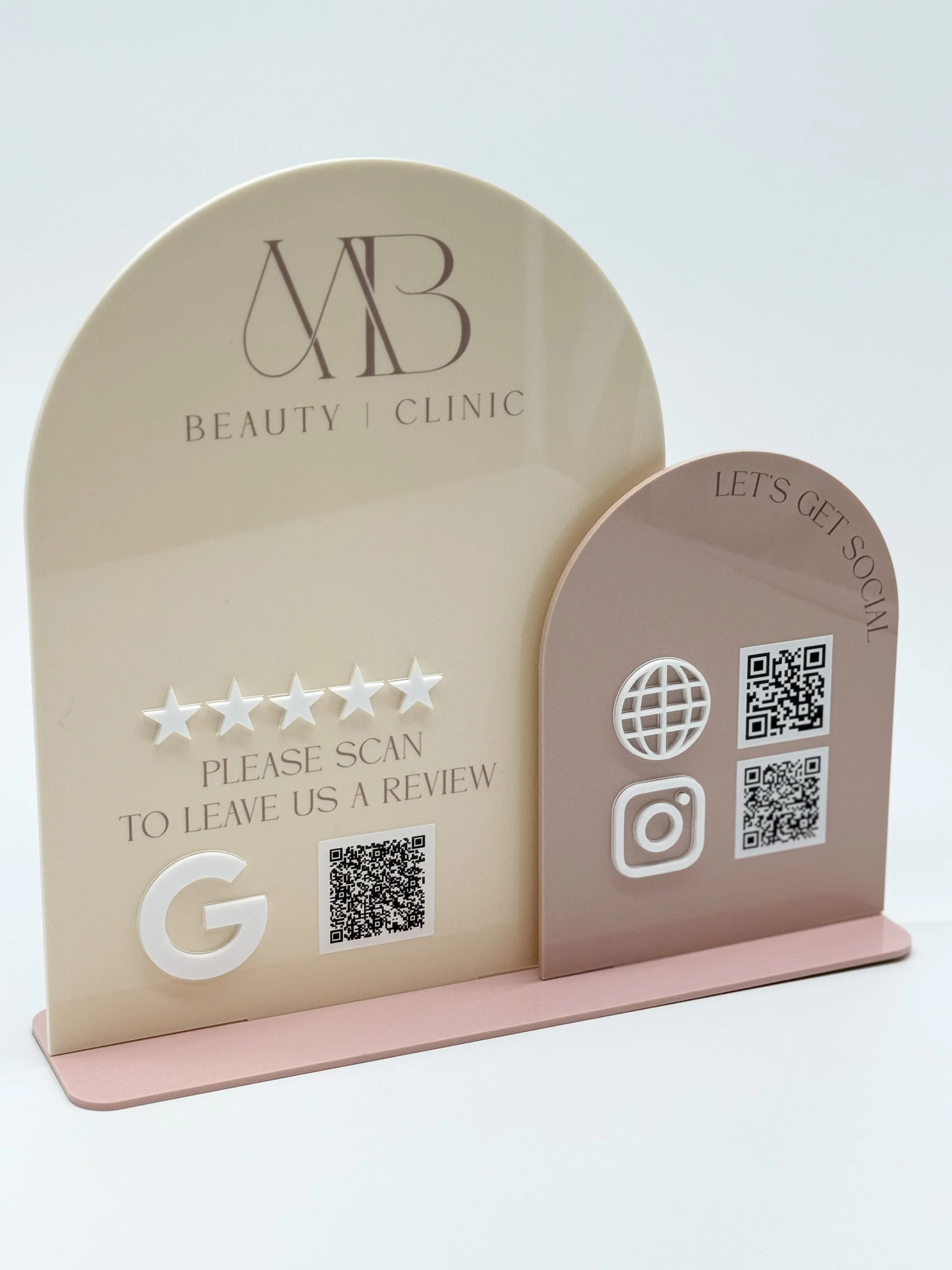 Decorative signage with QR codes, social media icons, and text for a beauty clinic.