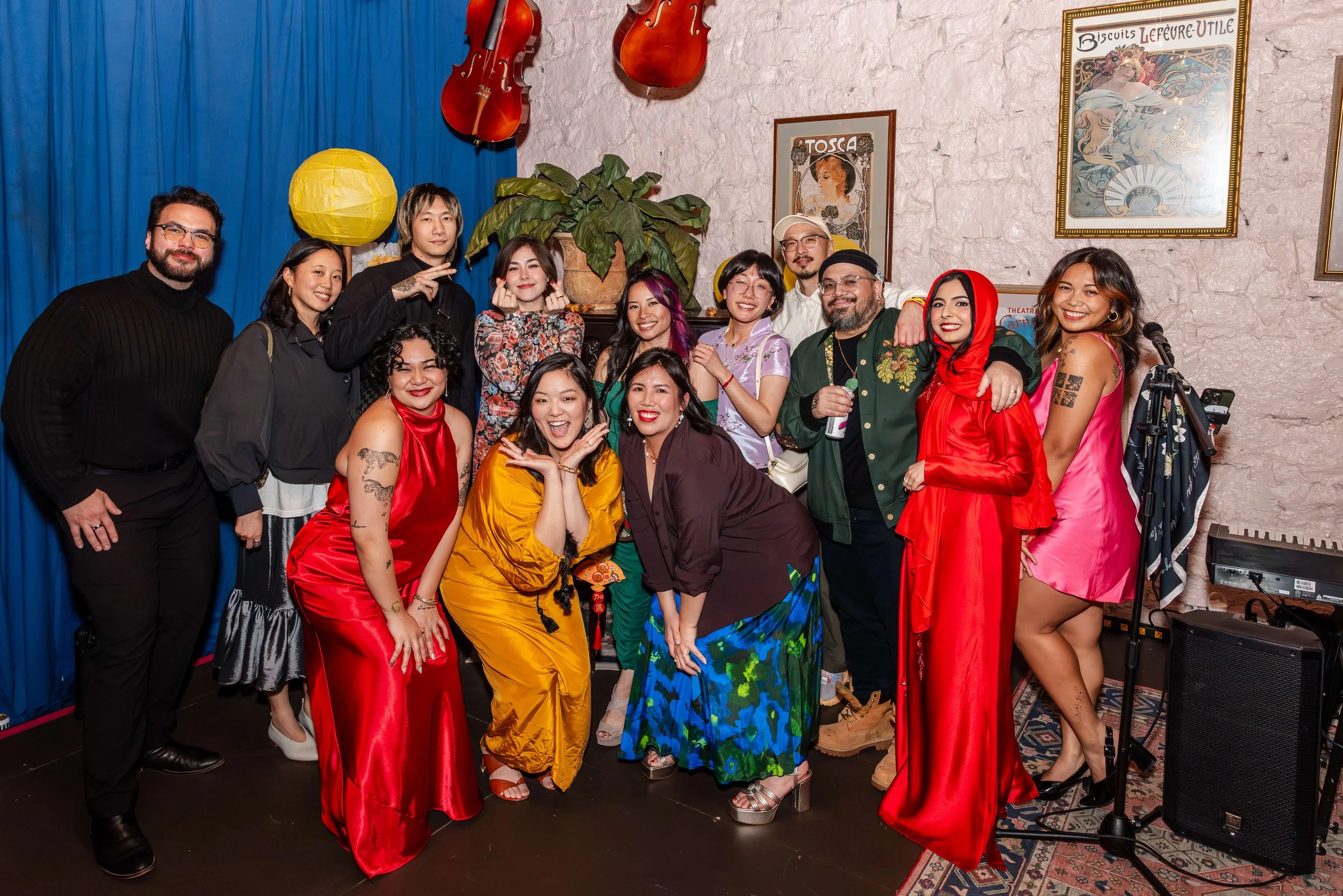 Staff and AAPI artists posing together during Lunar New Year celebration.