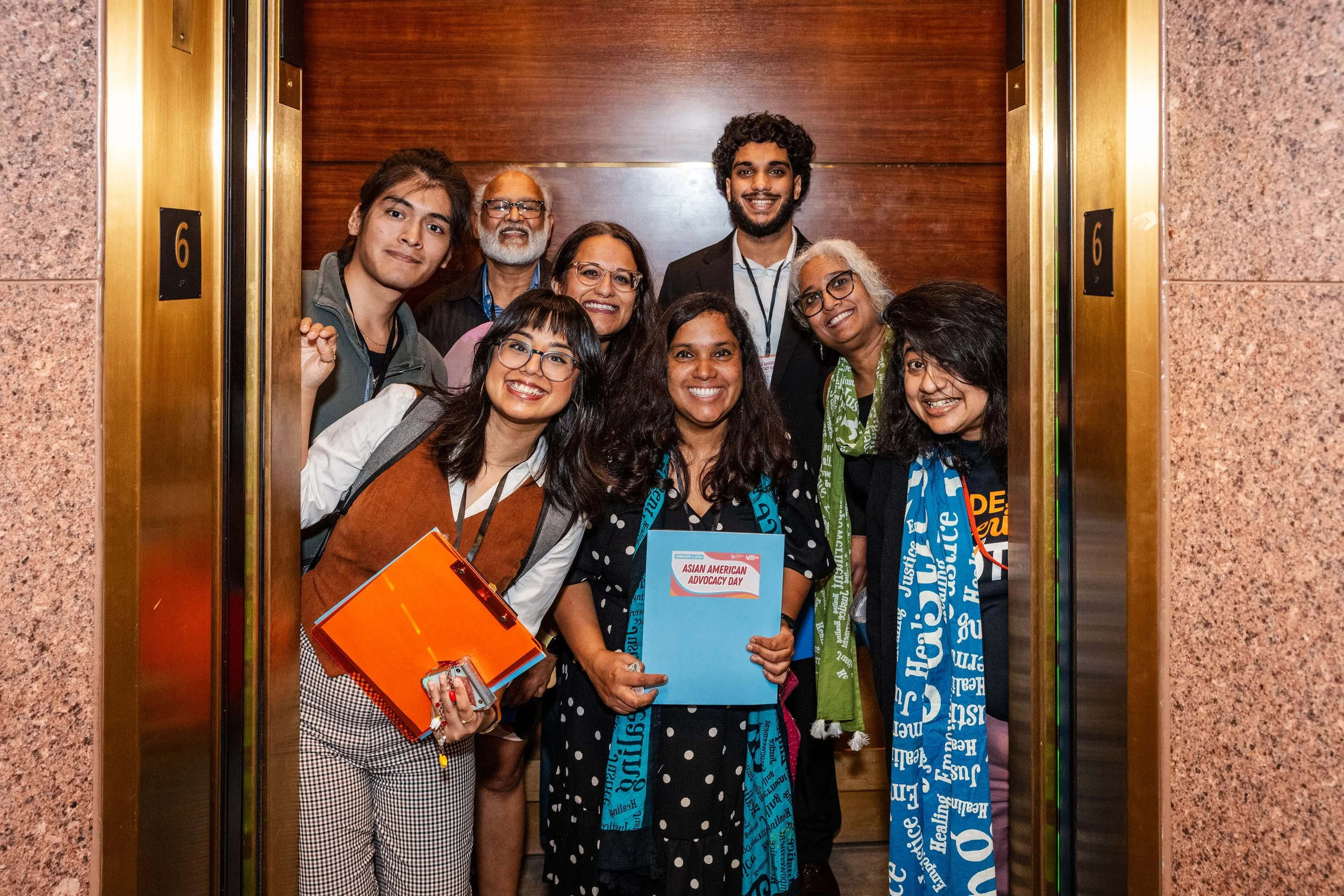 Advocates packed in an elevator at the Georgia state capitol during Asian American Advocacy Day. 