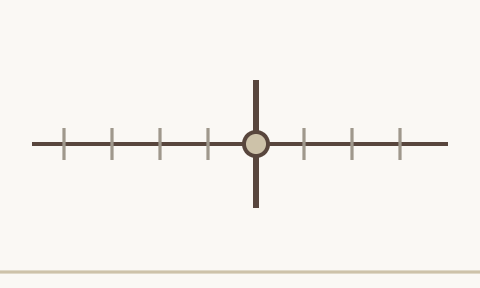 Close-up of a crosshair indicator on a scope or reticle.