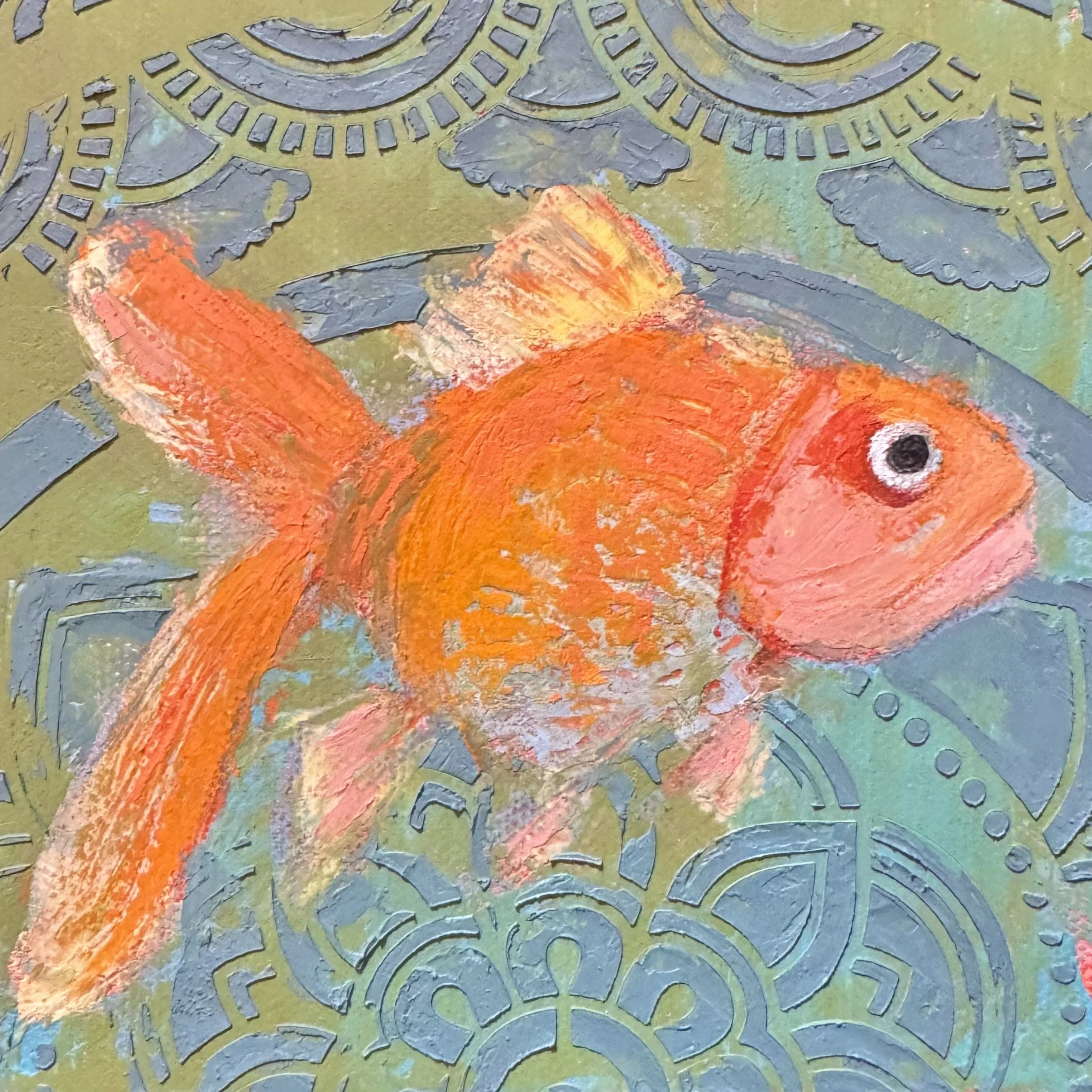 Painting of an orange fish on a decorative green background with intricate patterns.