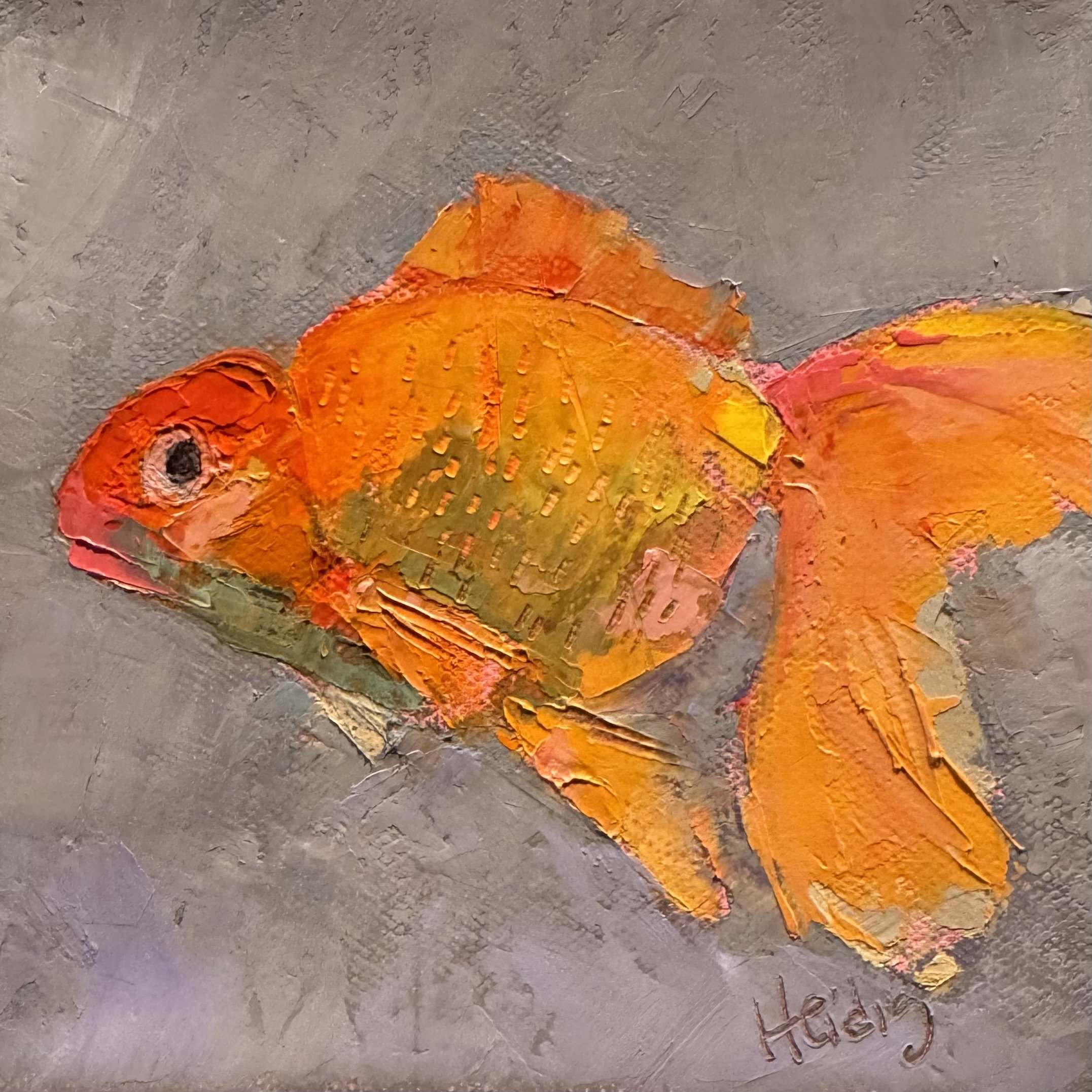 Painting of an orange fish with a textured gray background, signed by the artist Theresa Heidig Rooney.
