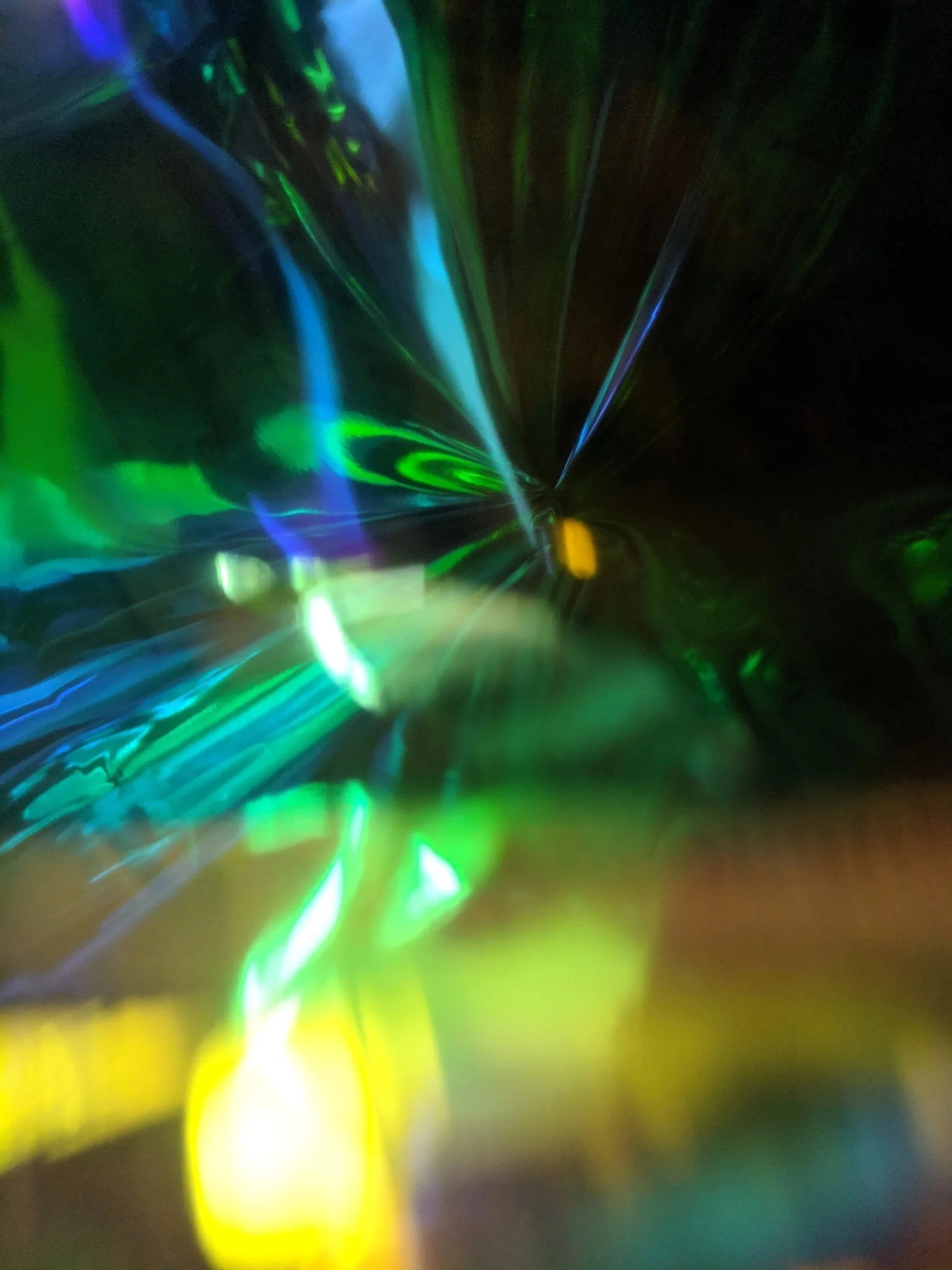 High-contrast abstract with dazzling lights against a shadowy background