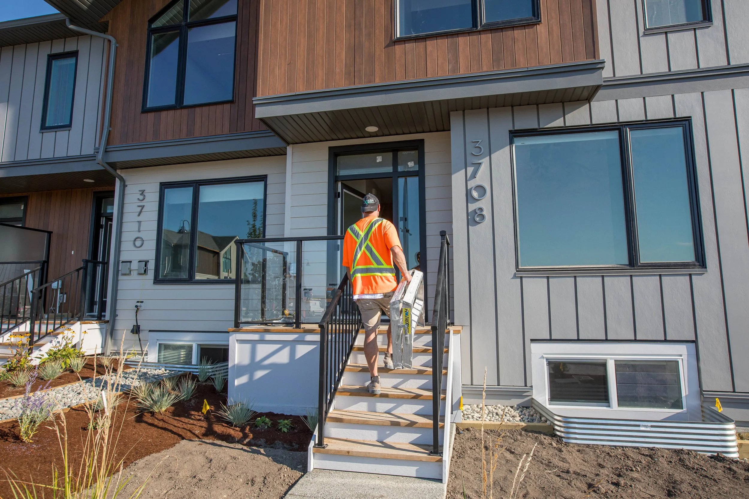 Experienced drywall contractors working on a commercial site in the South Island region.