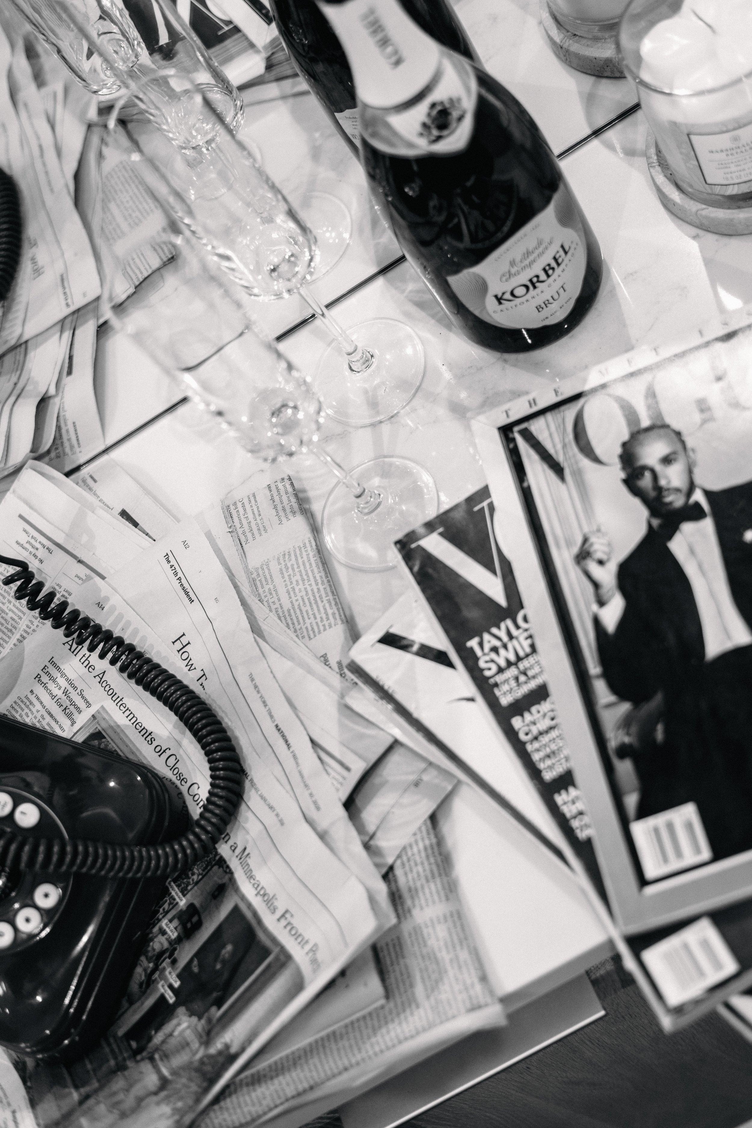 LŪK House of Beauty aesthetic with champagne, Vogue magazines, and luxury salon styling tools