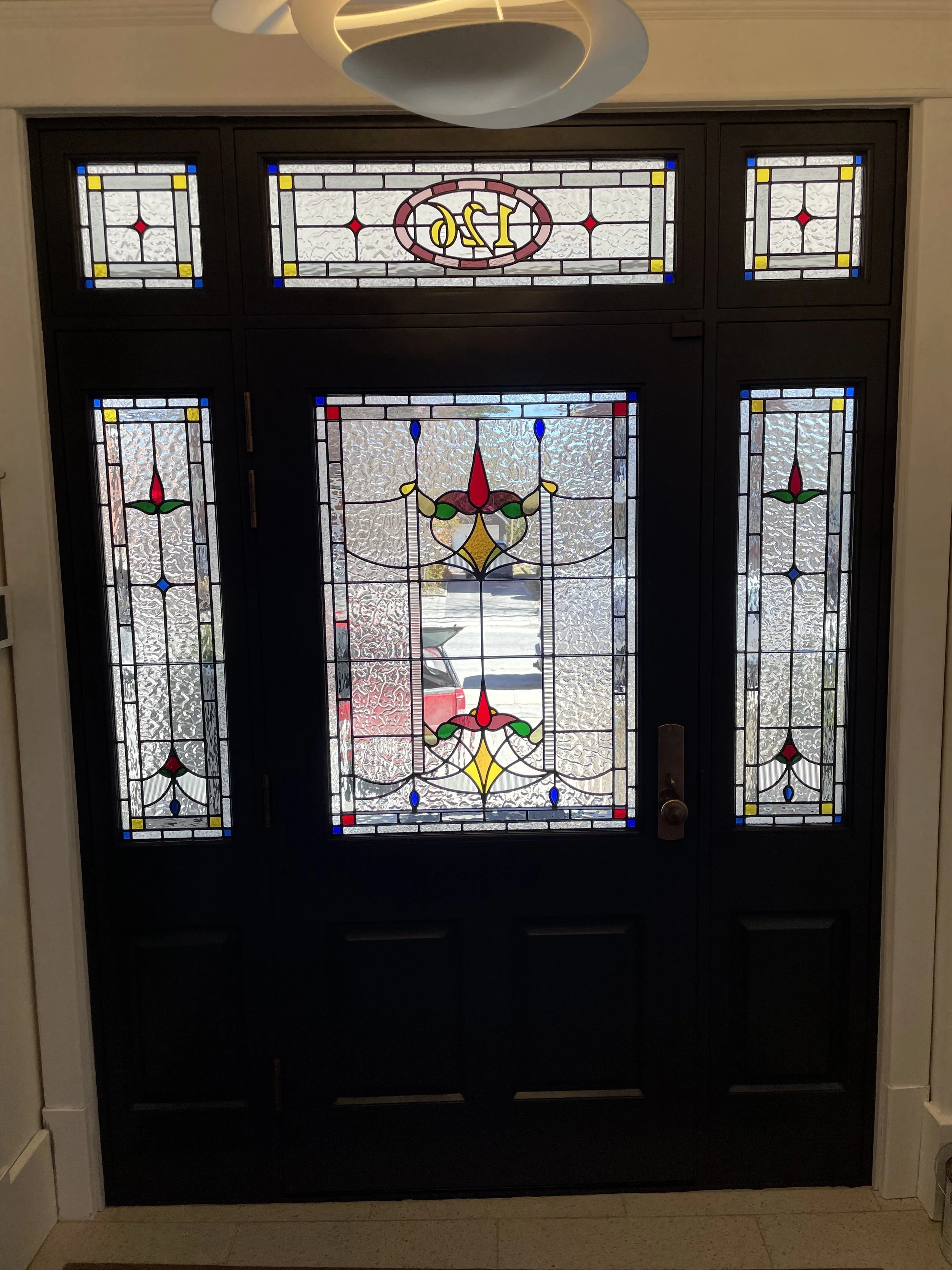 Custom architectural stained glass installation in Kingston Ontario residence.