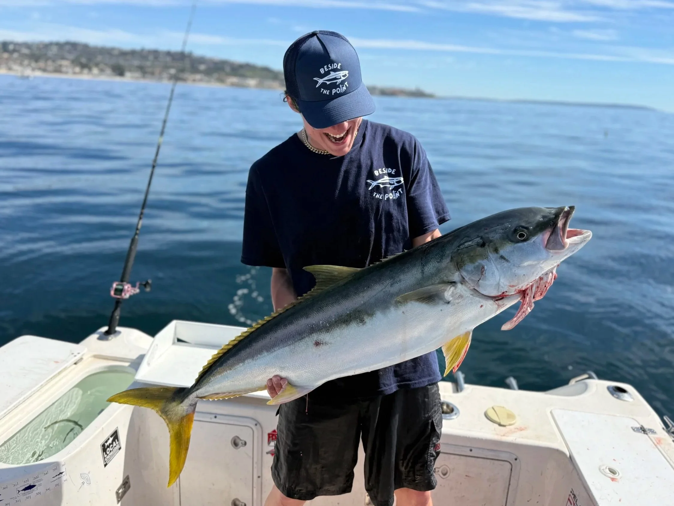 Angler holding a large yellowtail in La Jolla.