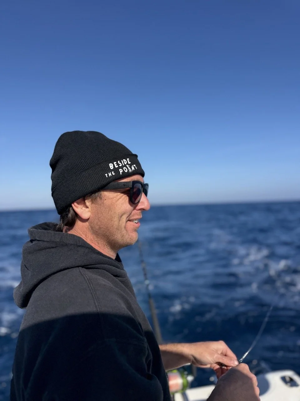 Beside The Point beanie on san diego fisherman