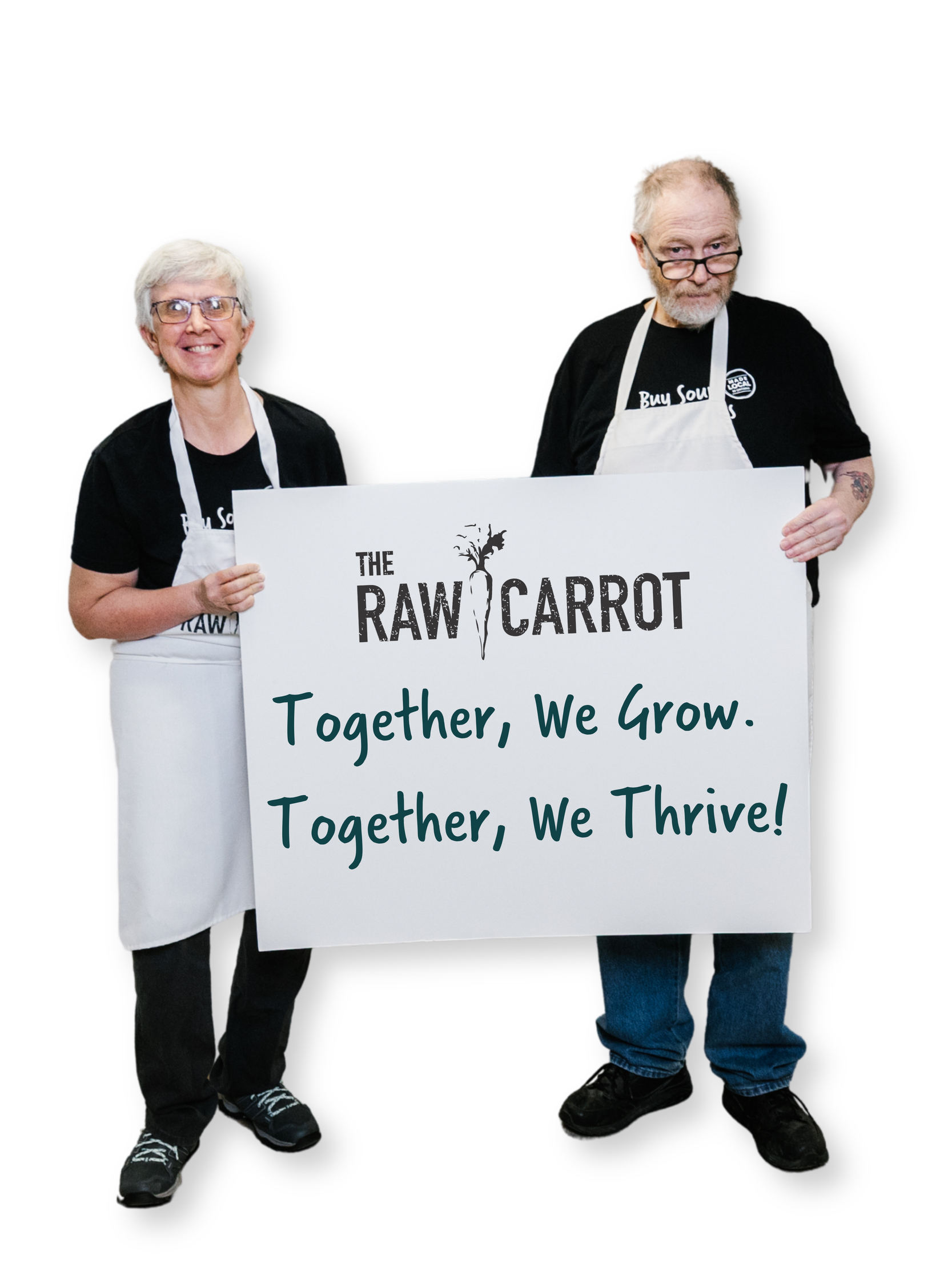 Two staff members holding sign that says together we grow, together we thrive.