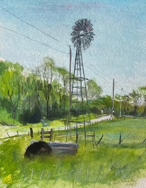 Watercolor painting of a rural landscape featuring a windmill, green trees, a grassy field, a wooden fence, and a clear blue sky.
