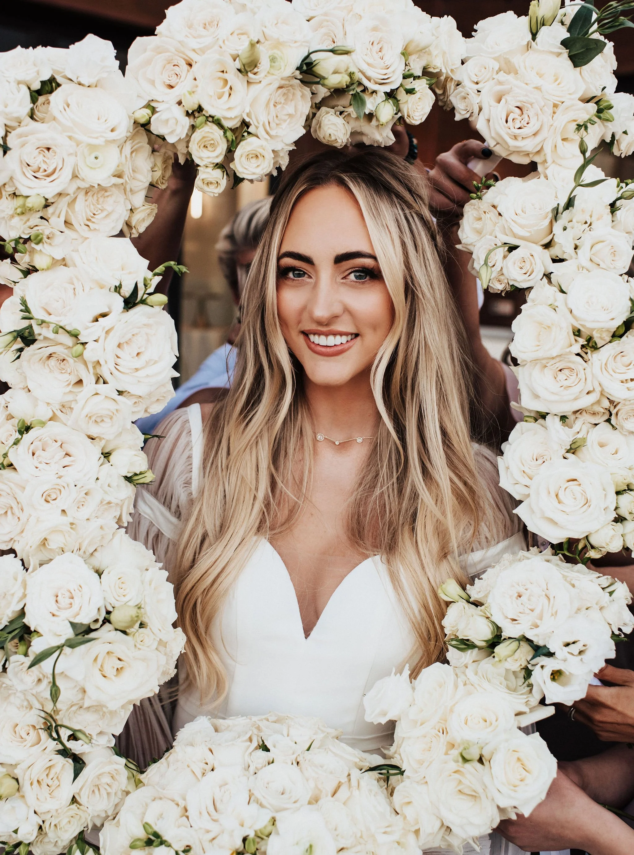 bride-framed-by-white-wedding-bouquets.jpg