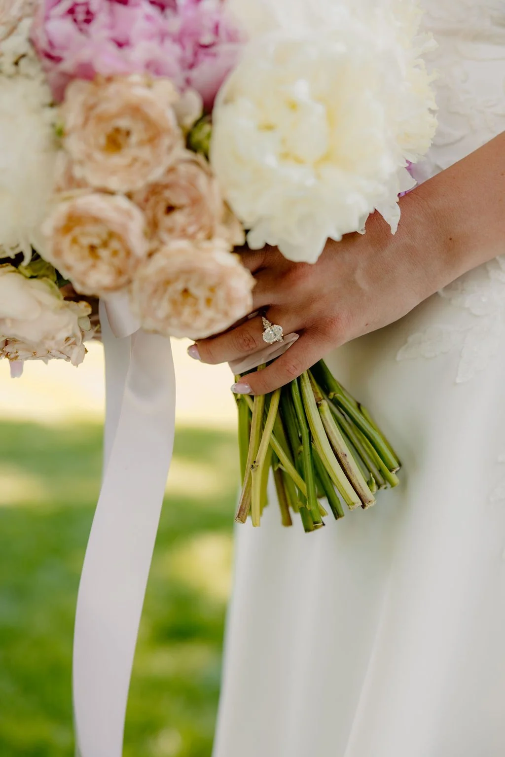 A breathtaking display of luxury wedding florals by Blooms by Tesla for a high-end celebration in Alpine, Utah. This design features a lush, romantic blend of creamy white roses, soft blush peonies, and delicate sweet peas, creating a timeless pink a