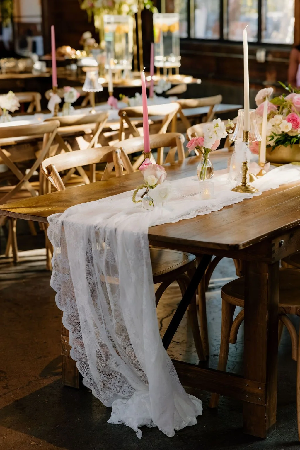 A breathtaking display of luxury wedding florals by Blooms by Tesla for a high-end celebration in Alpine, Utah. This design features a lush, romantic blend of creamy white roses, soft blush peonies, and delicate sweet peas, creating a timeless pink a