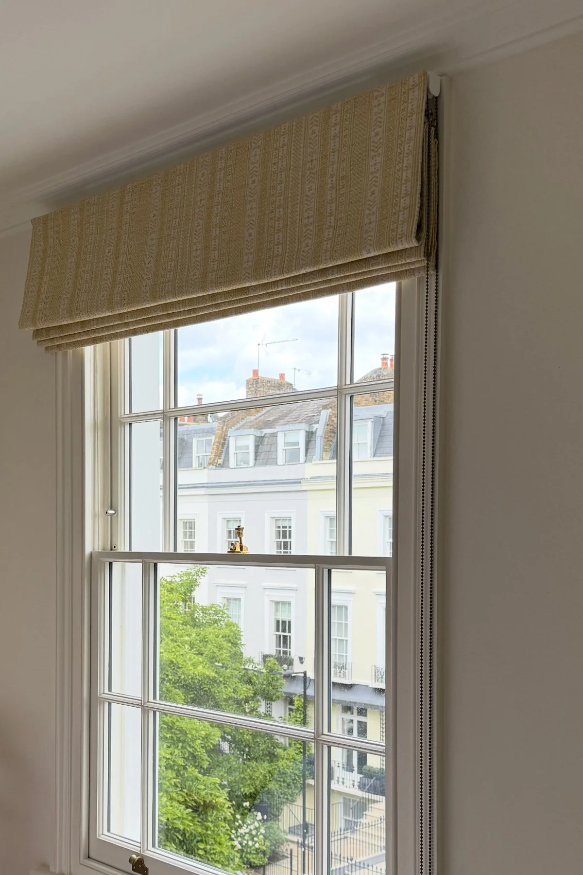 Handmade bespoke black out Roman blinds in Flores stripe from Teyssier.