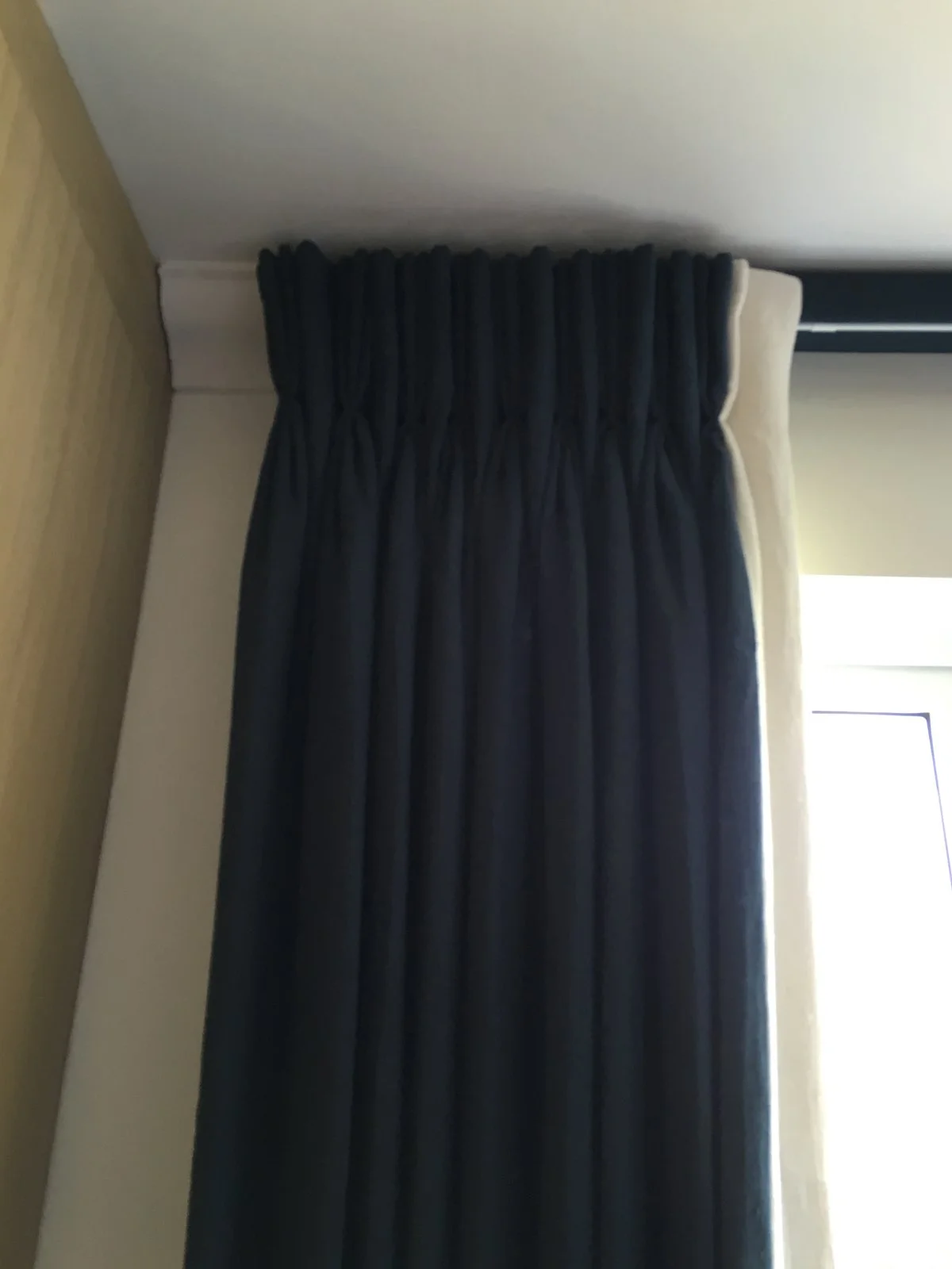 Handmade bespoke double pinch pleat black out & interlined curtains with leading edge border in linen from The Cloth Shop. Installed on covered board & facia.