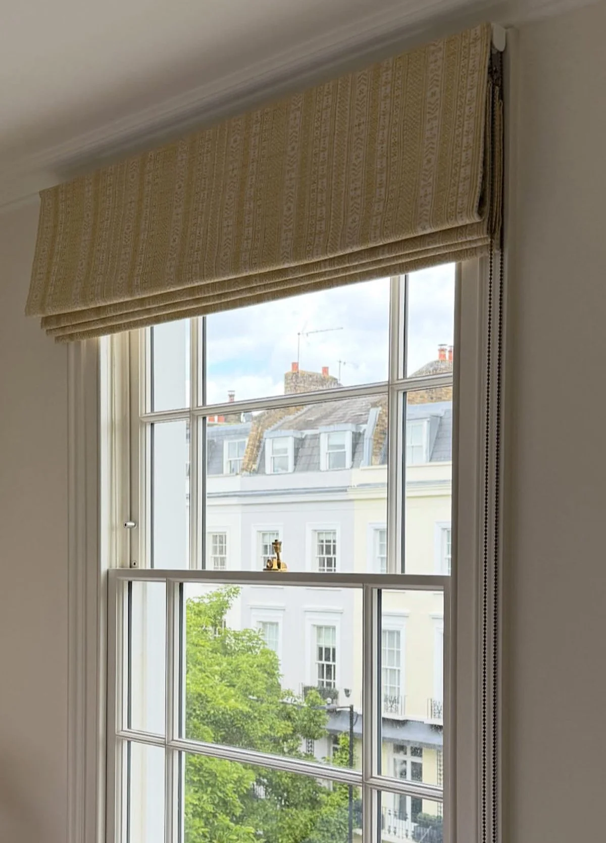 Handmade bespoke black out Roman blinds in Flores stripe from Teyssier.