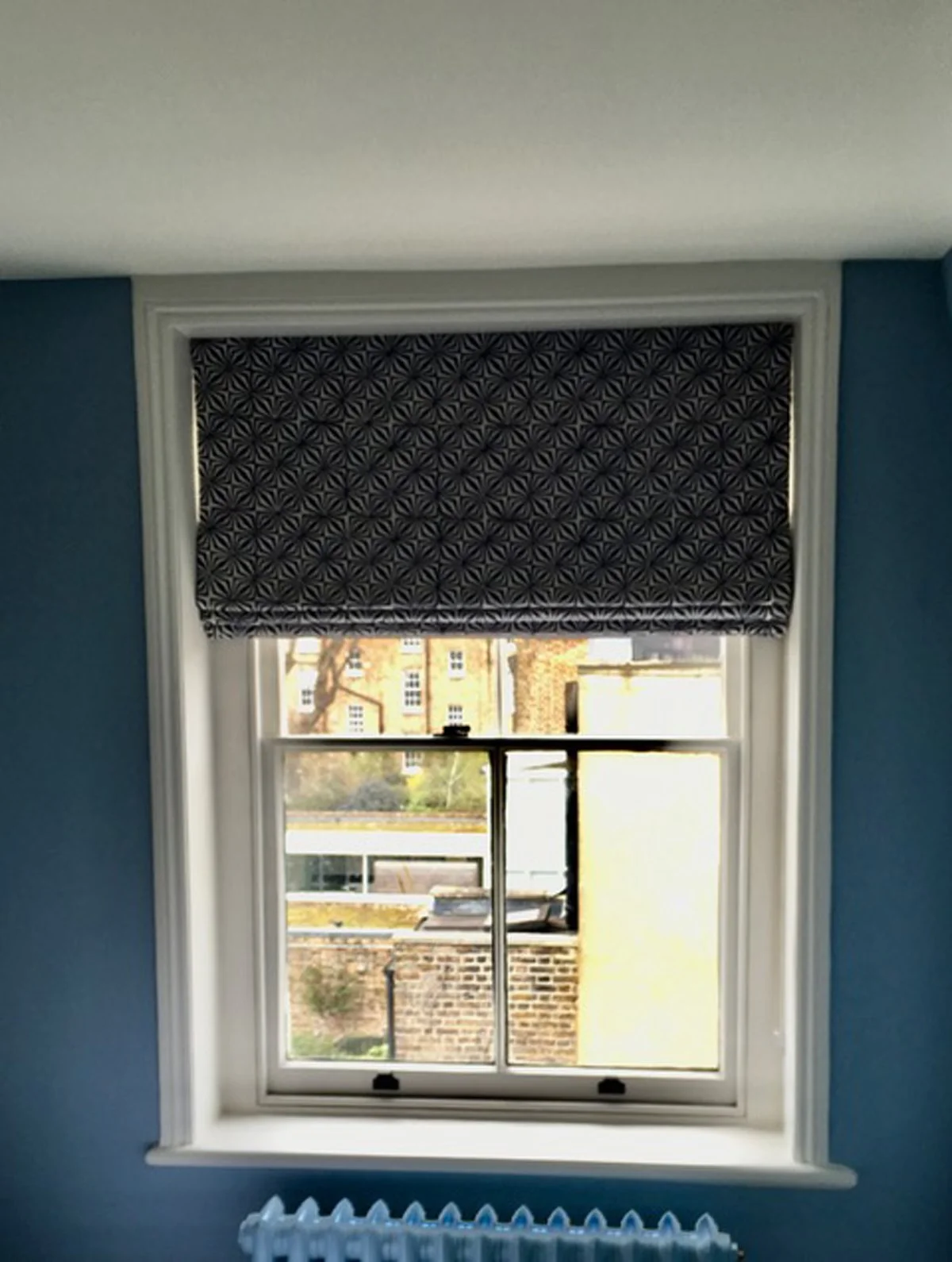 Handmade bespoke black out roman blind in Block print from The Cloth Shop.