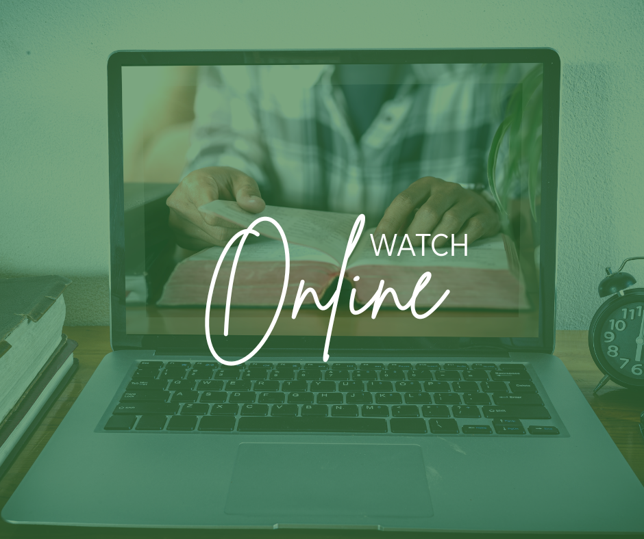 A laptop on a desk with the screen displaying an image of a person reading a book, with the words 'Watch Online' overlaid.