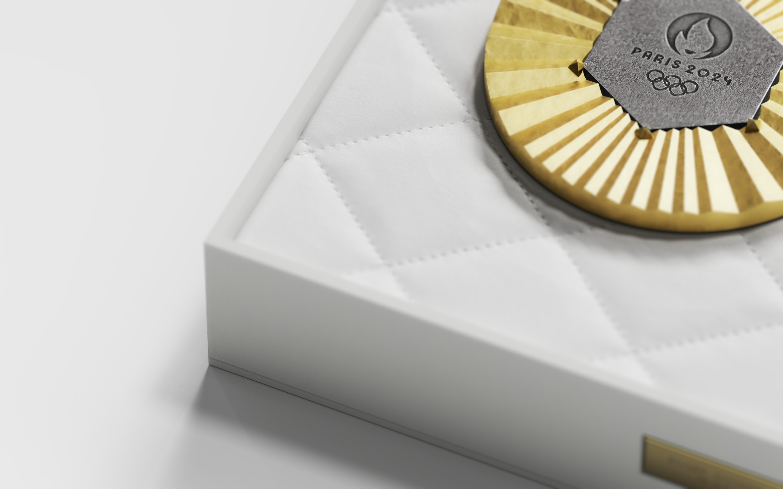 Explore a conceptual Olympic medal package designed as a timeless heirloom. Featuring fencing-inspired textiles and a convertible display pedestal for athletes