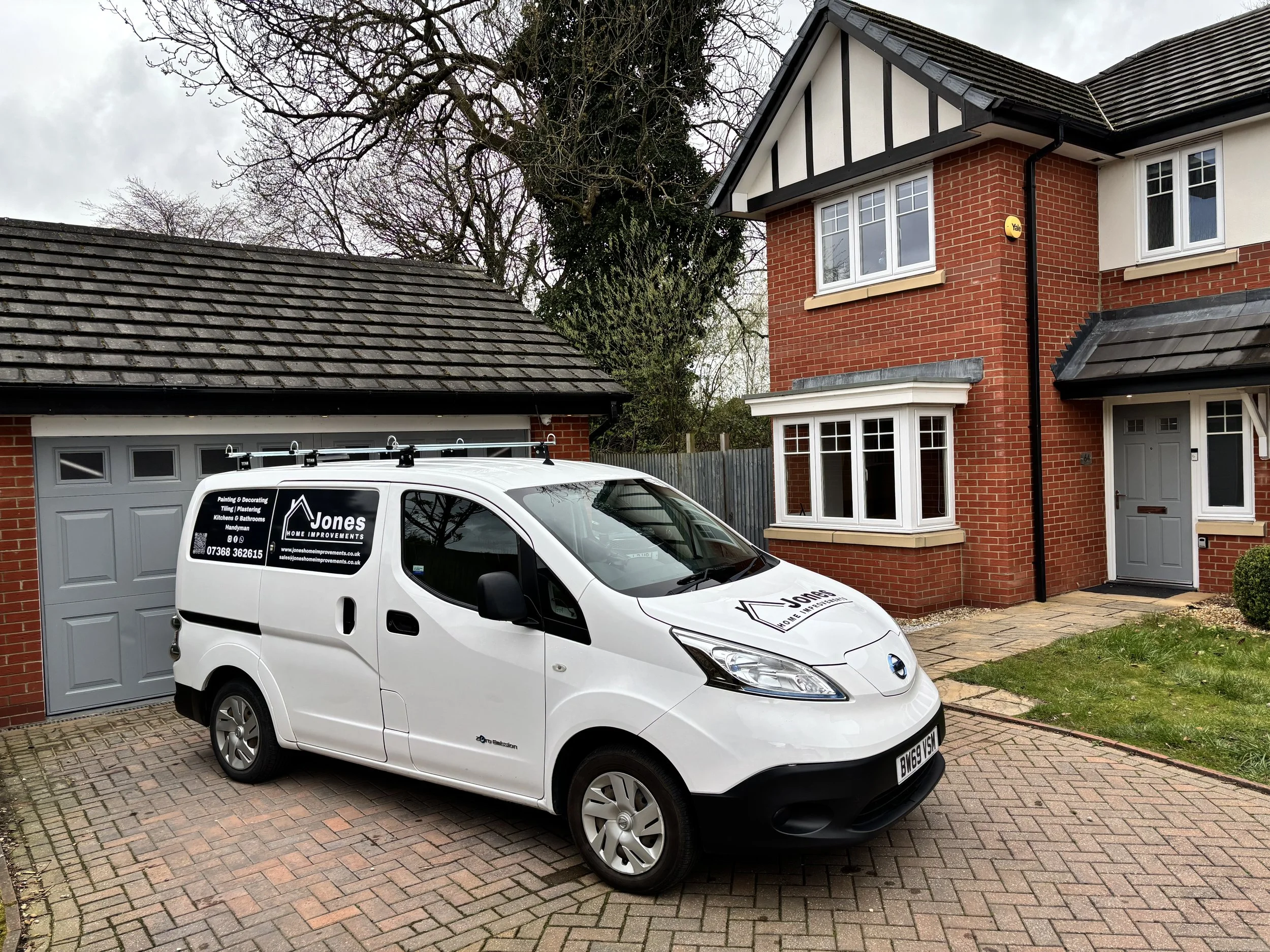 Van with Company logo on outside house