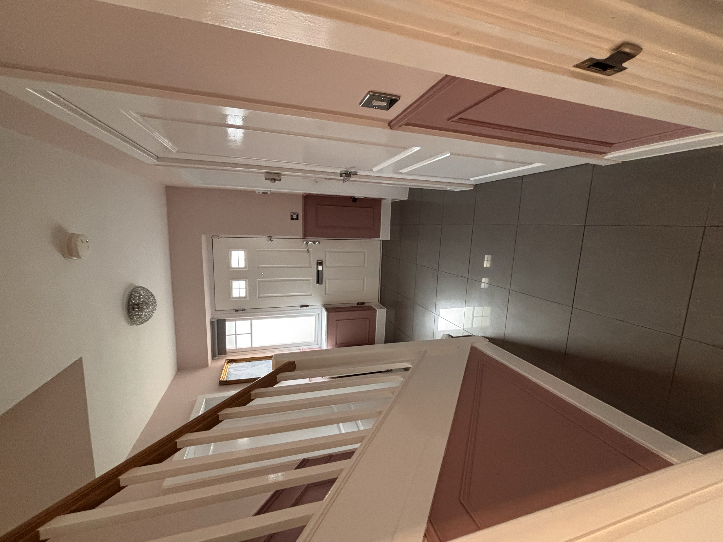 Two Tone wall with wood panels and dado rail